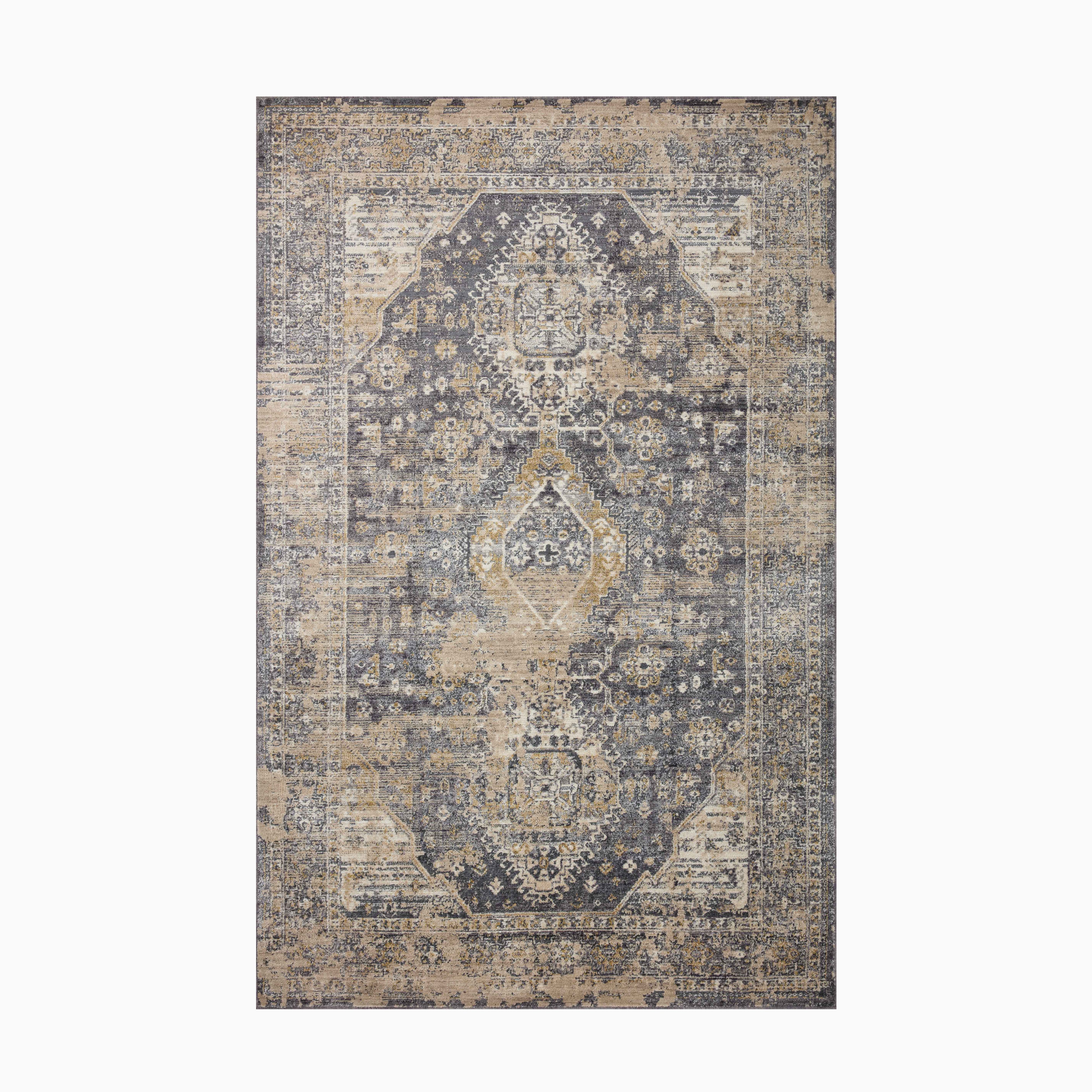 Power-loomed rug made from a polyester and polypropylene blend, featuring deep navy and warm beige tones with a distressed vintage medallion design.