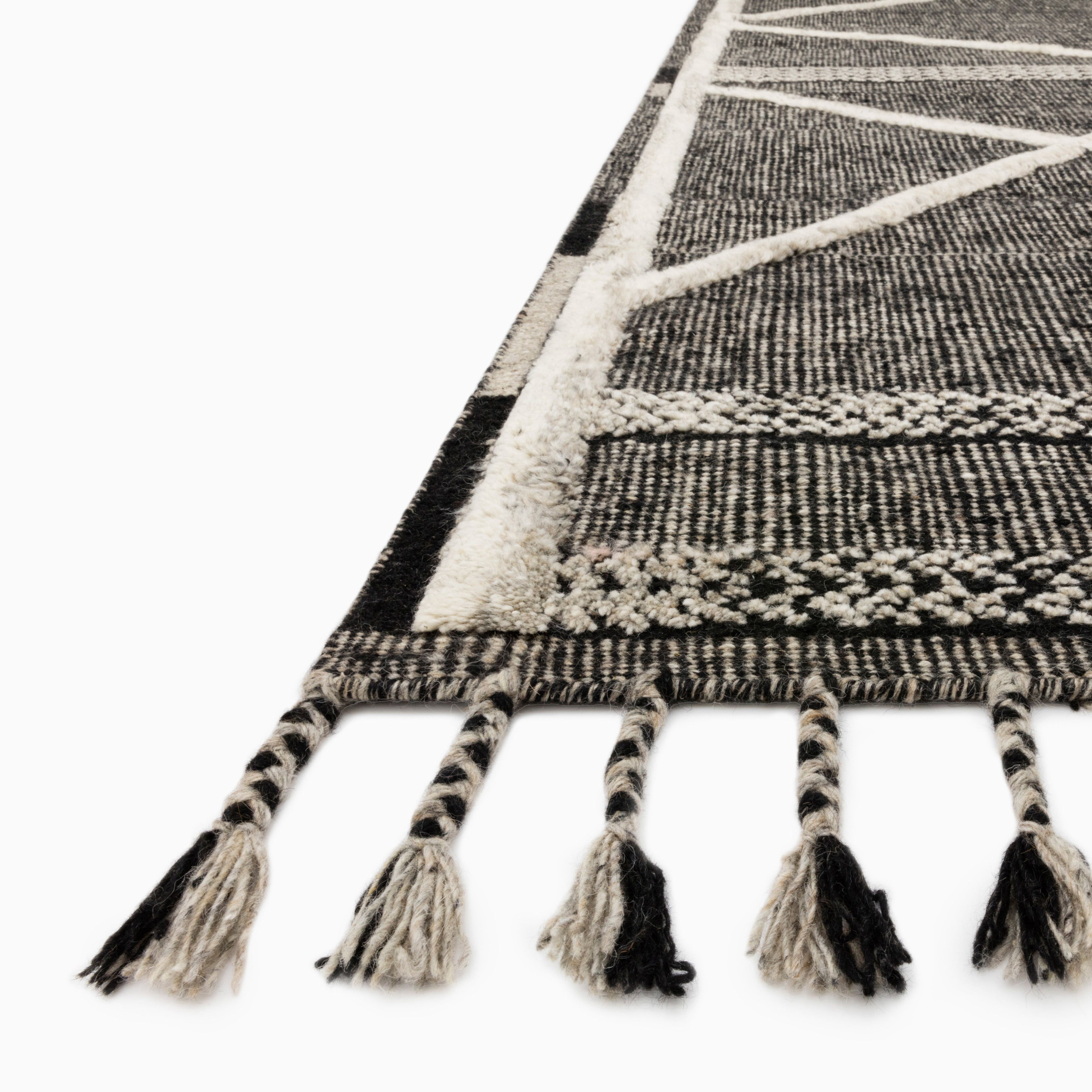 Micah Wool Blend Rug in Natural / Graphite, blending deep charcoal tones with contrasting ivory lines and fringed edges, ideal for contemporary decor.