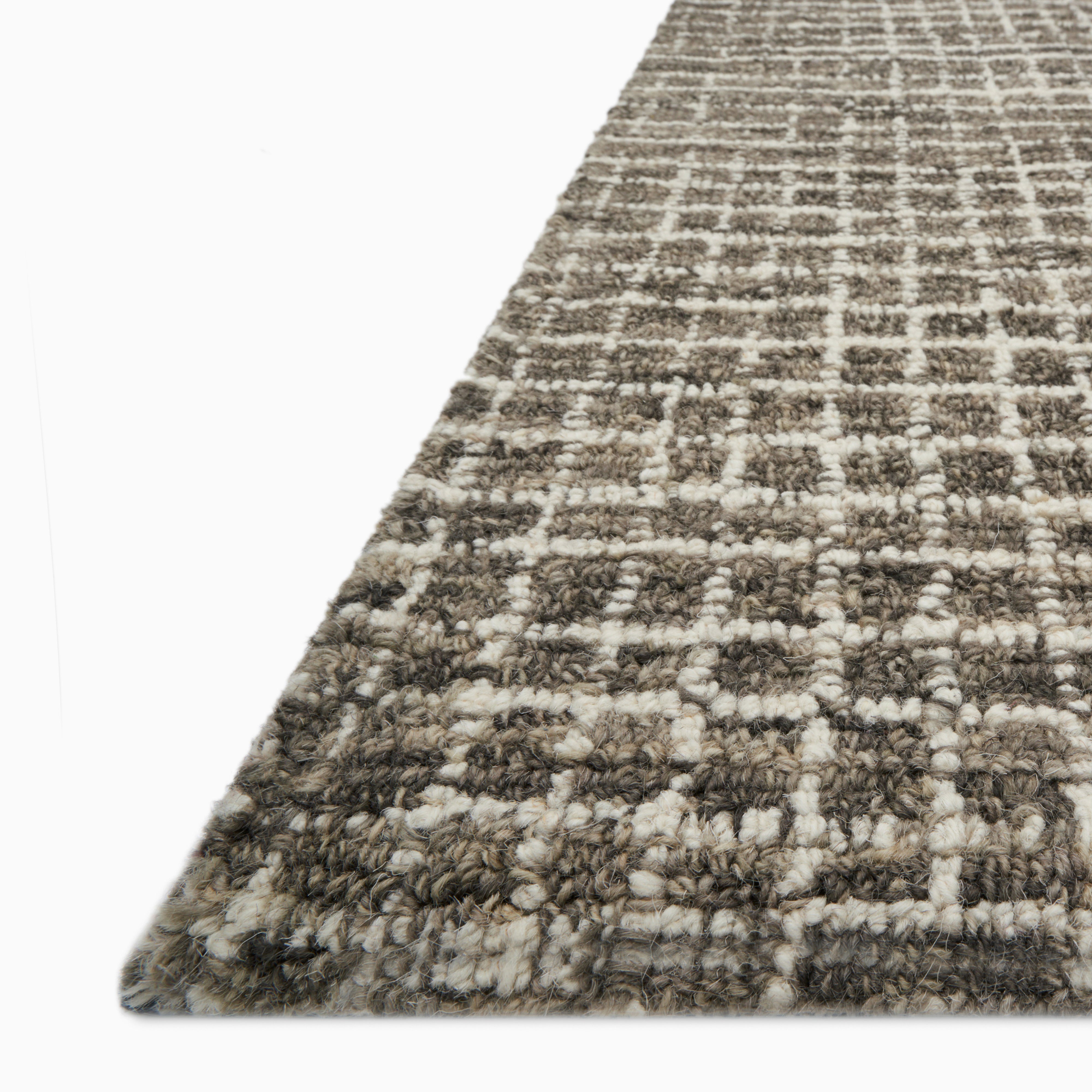 Sweeney Wool Pile Rug in deep graphite with a finely woven grid texture, blending charcoal and lighter gray tones for a modern, structured look.