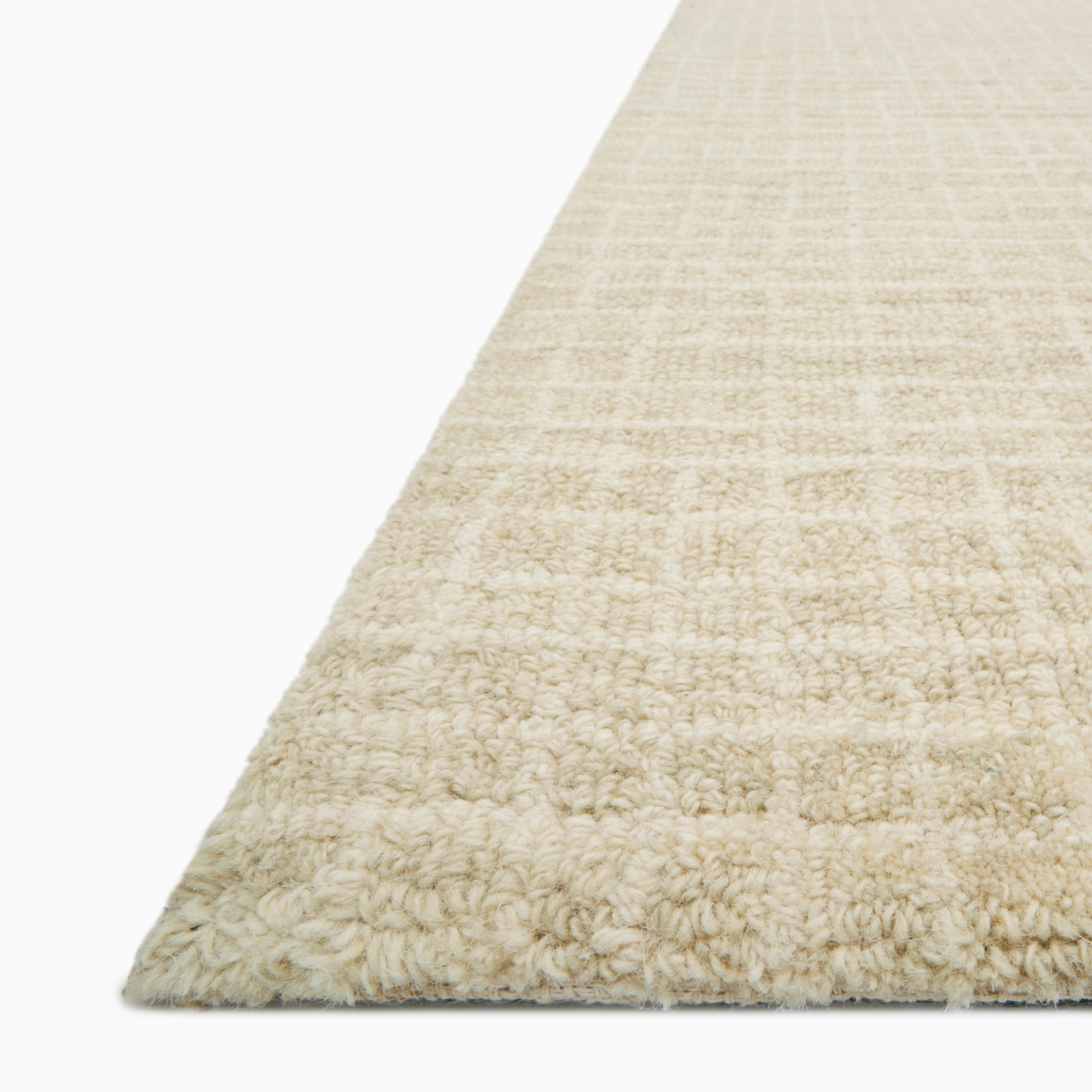Sweeney Wool Pile Rug in soft linen, featuring a woven texture with a subtle grid pattern in warm beige and cream for a timeless look.