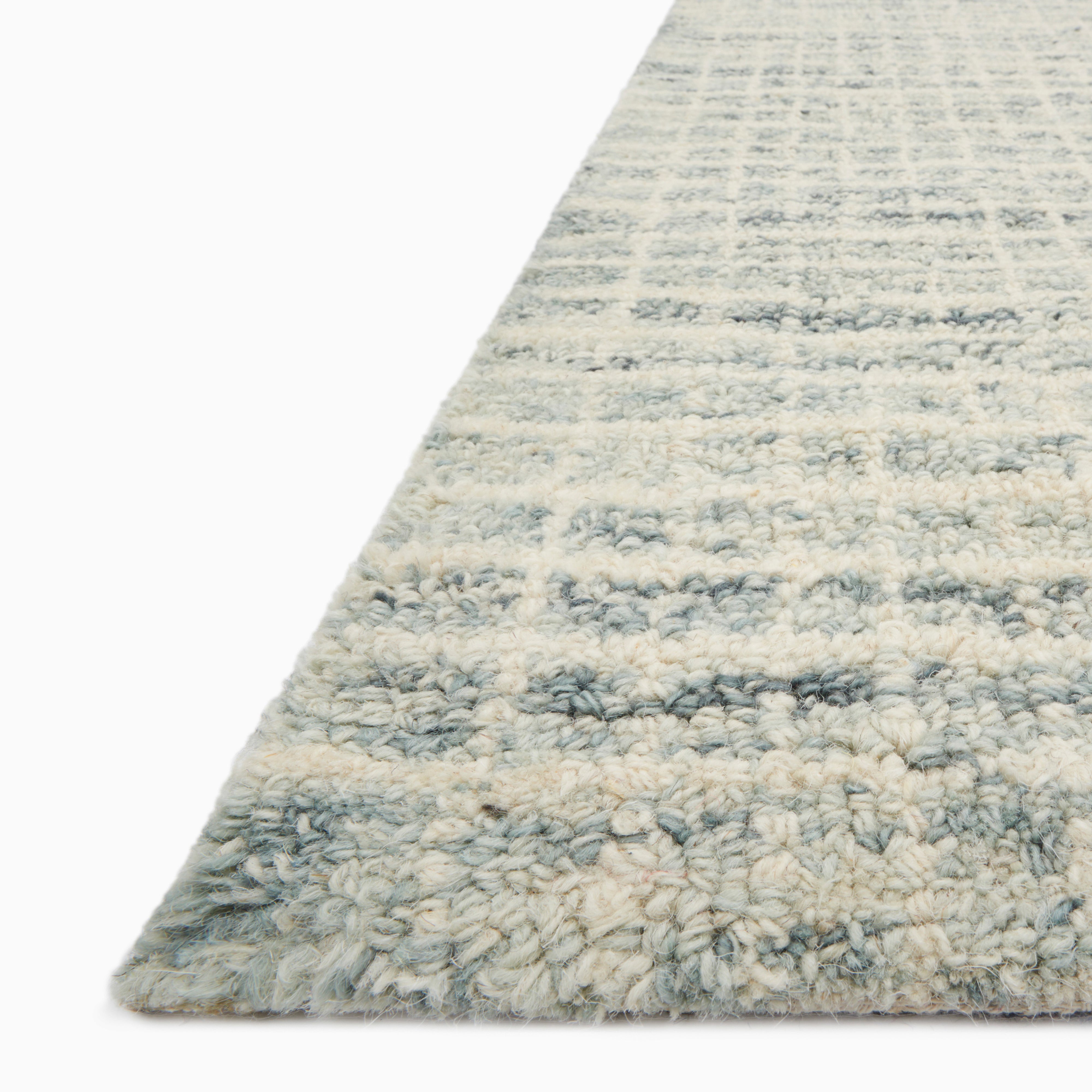 Sweeney Wool Pile Rug in soft beige and muted blue, featuring a textured woven pattern for a relaxed, contemporary look.