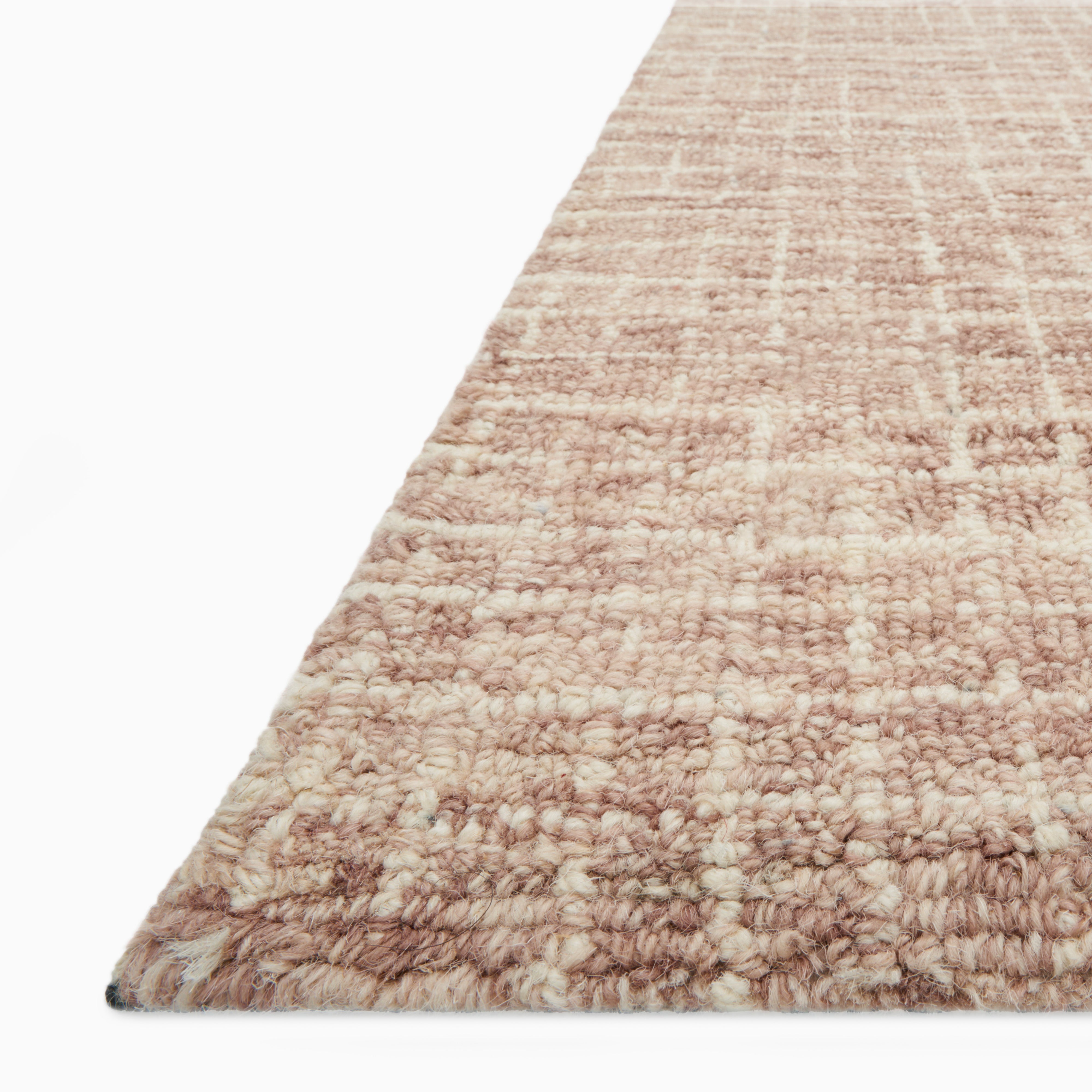 Sweeney Wool Pile Rug in warm rust with a soft woven texture, featuring a subtle grid pattern blending terracotta and beige tones.