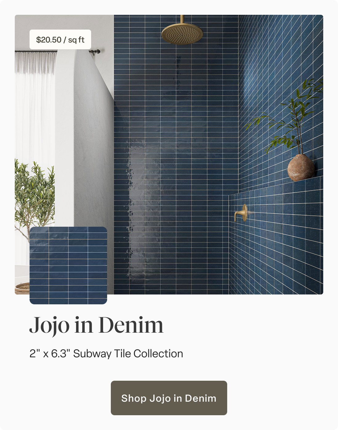 Glossy Jojo Ceramic Subway Tiles in rich denim blue add bold elegance to a modern shower, accented by sleek brass fixtures. Shop Jojo in Denim