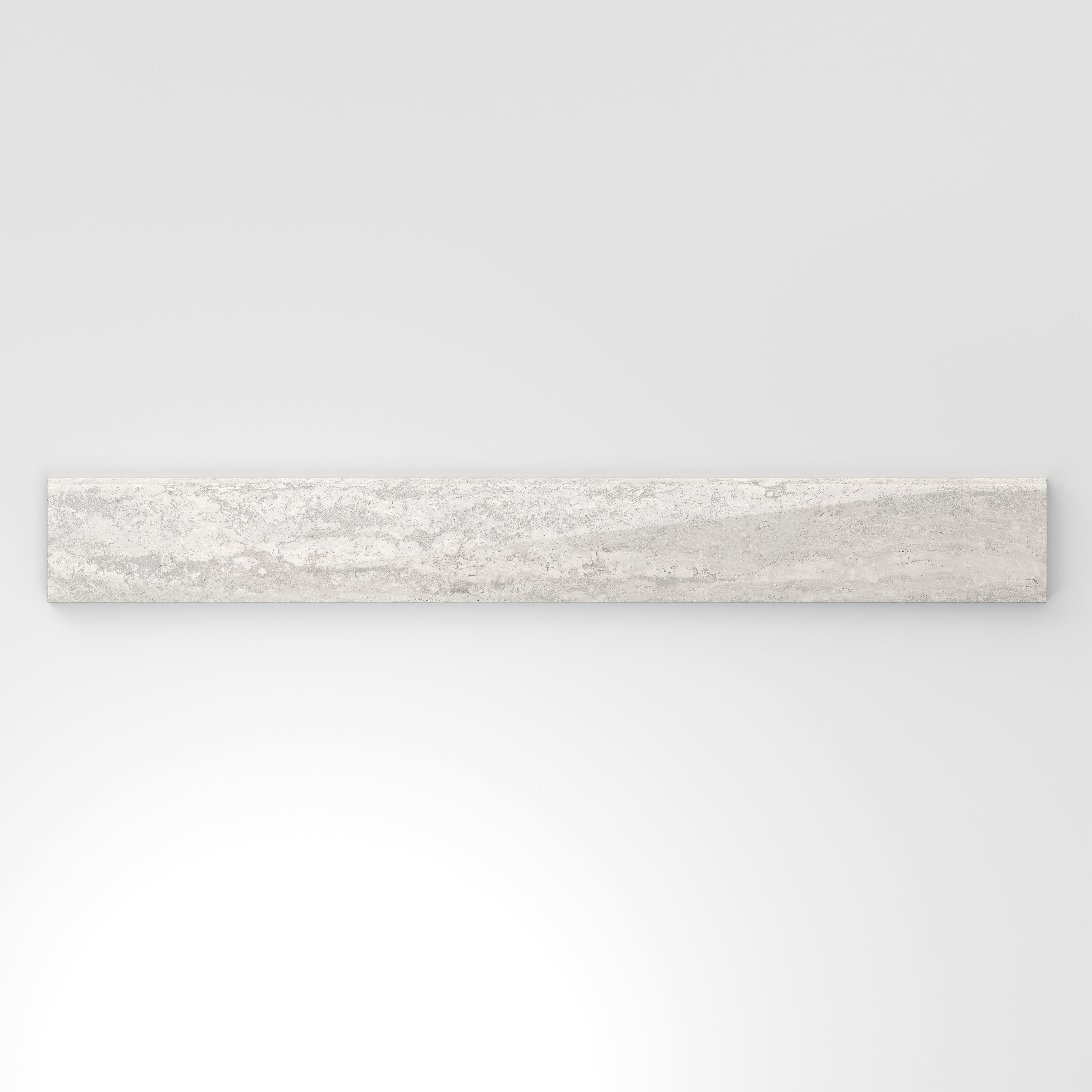 Light gray travertine-look porcelain 3x24 polished bullnose tile with delicate veining, soft tonal movement, and a rounded profile.