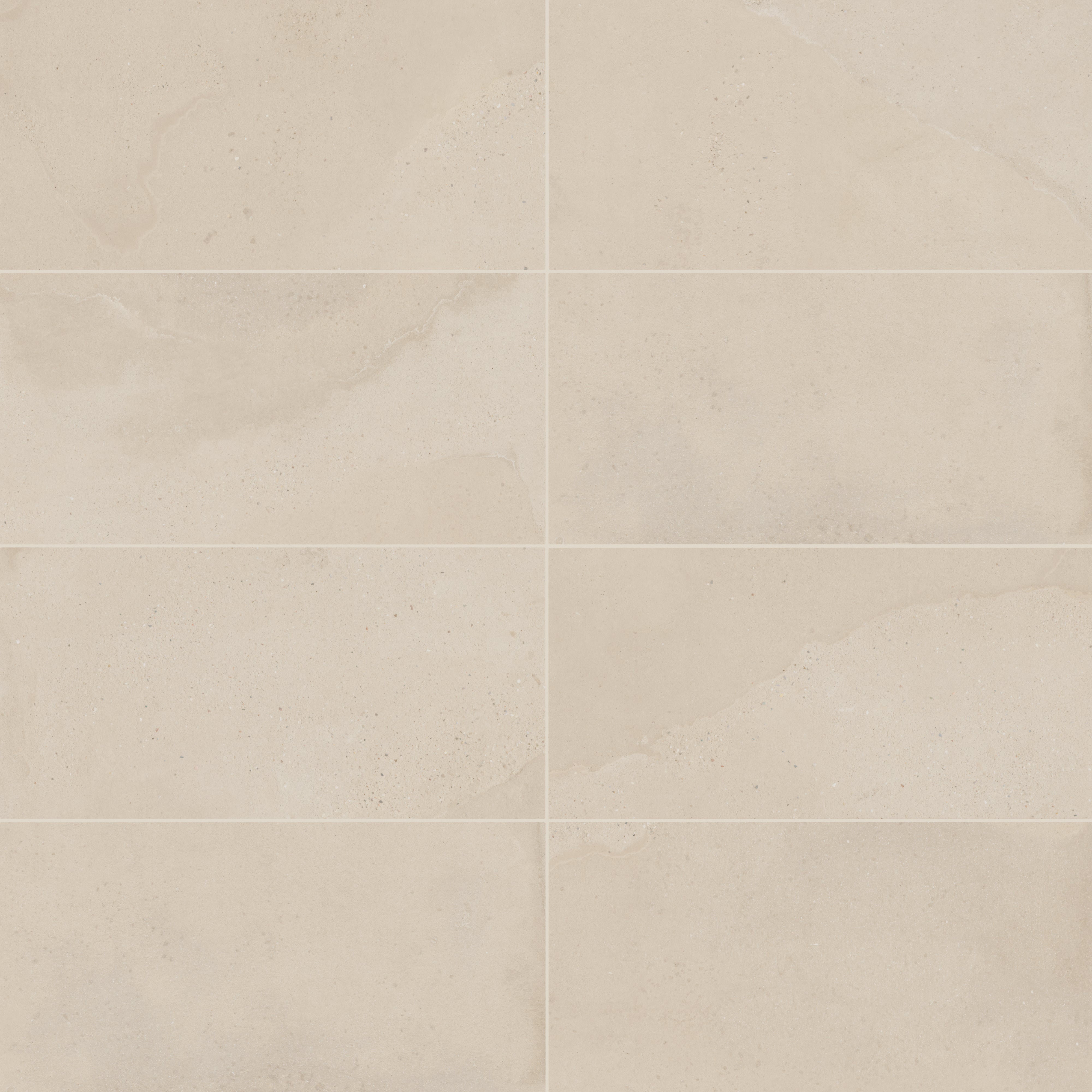 Warm beige matte porcelain tile in a classic rectangular format, featuring visual mineral flecks inspired by the shifting texture of Italian Riviera sand.