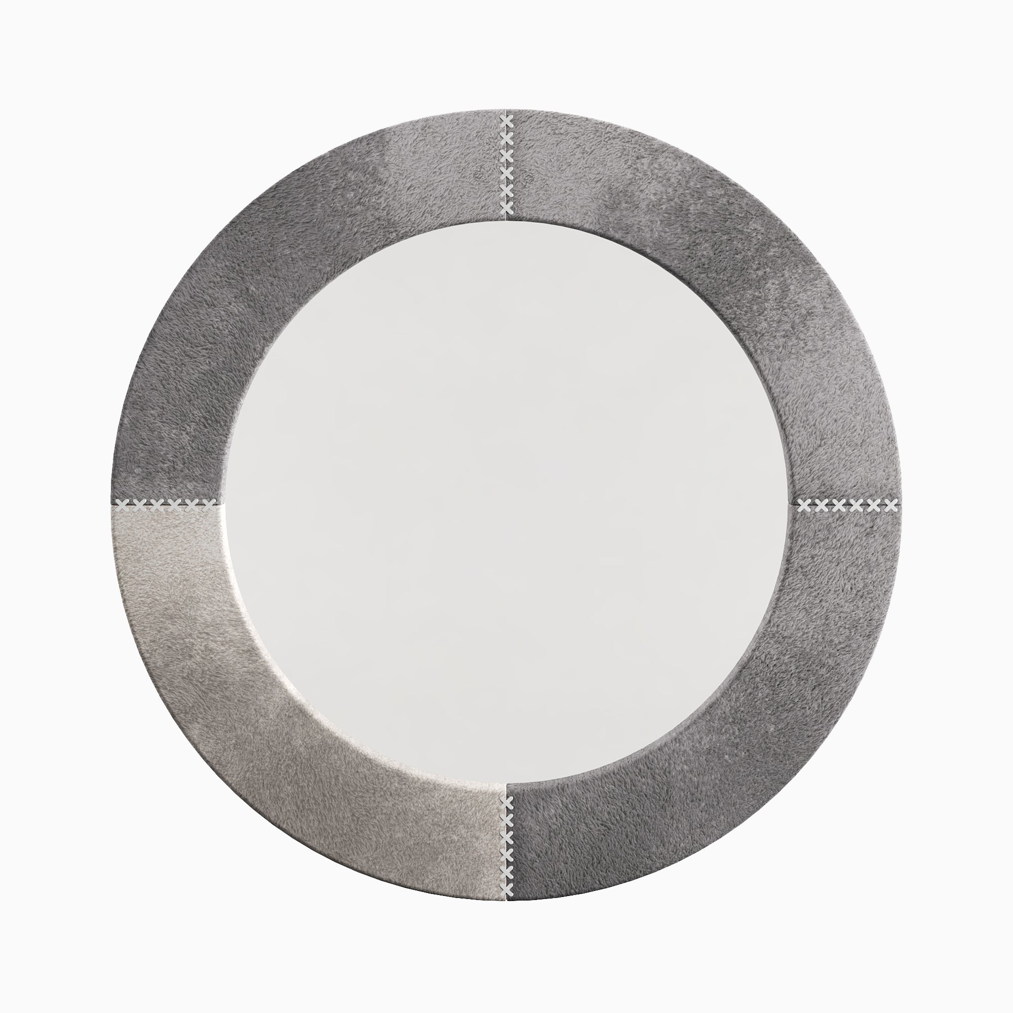 Round mirror wrapped in gray hair-on cowhide with subtle tonal variation and white leather whip-stitch accents referencing classic saddlework.