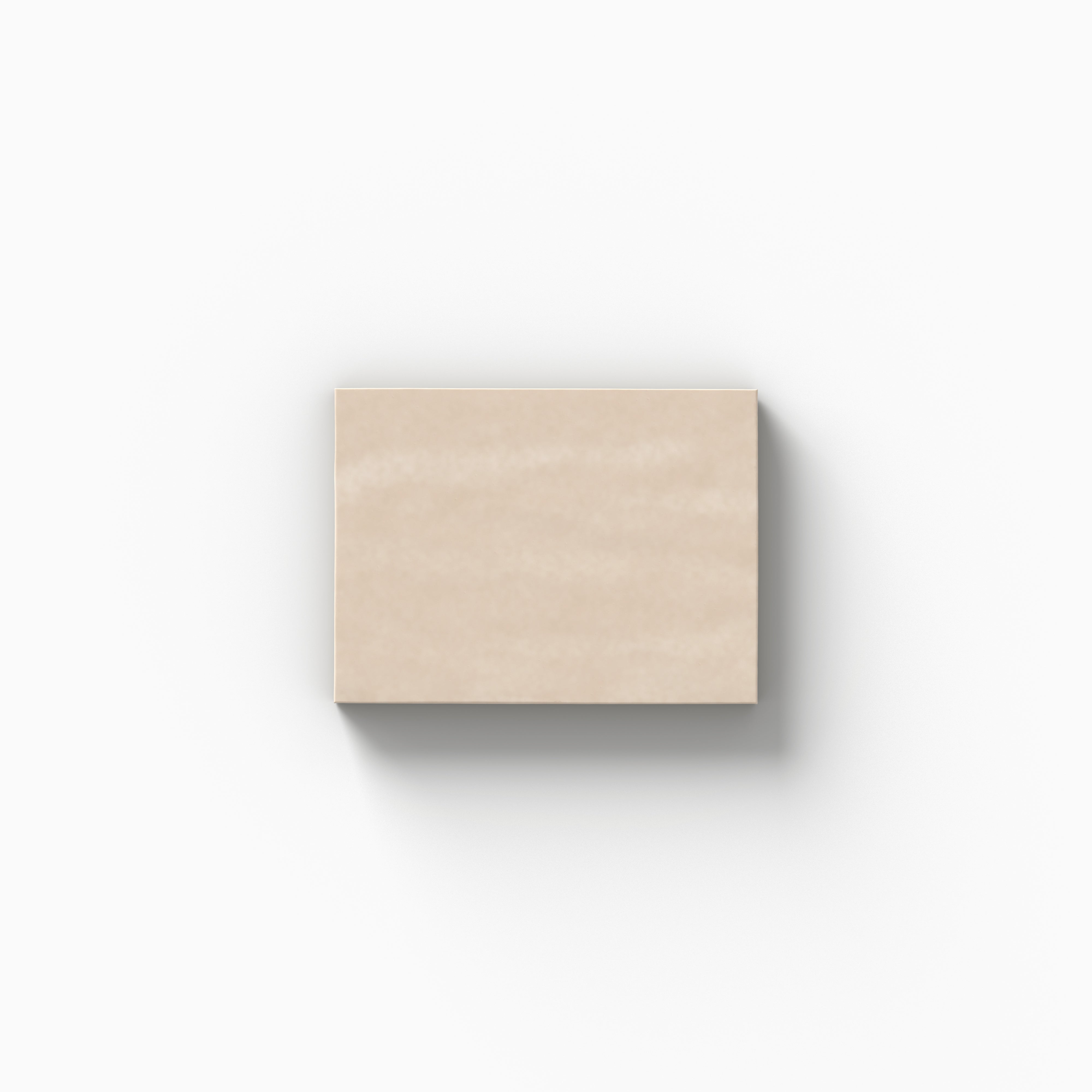 Glossy 3x4 porcelain tile sample in a warm beige hue, displayed on a white background to highlight its handcrafted appearance and subtle surface texture.