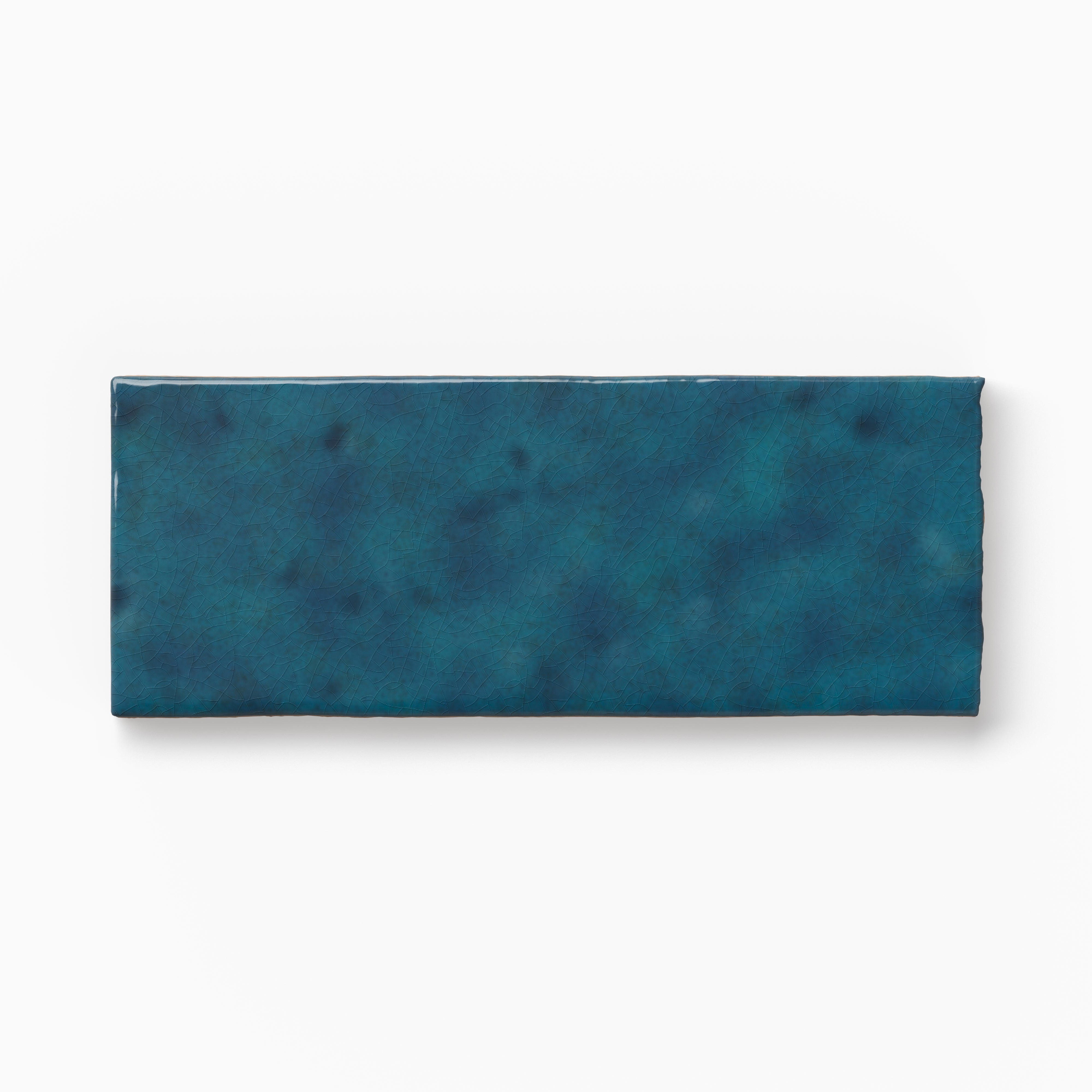 Elongated blue tile sample featuring layered color movement, a handcrafted appearance, and delicate surface texture on a white background.