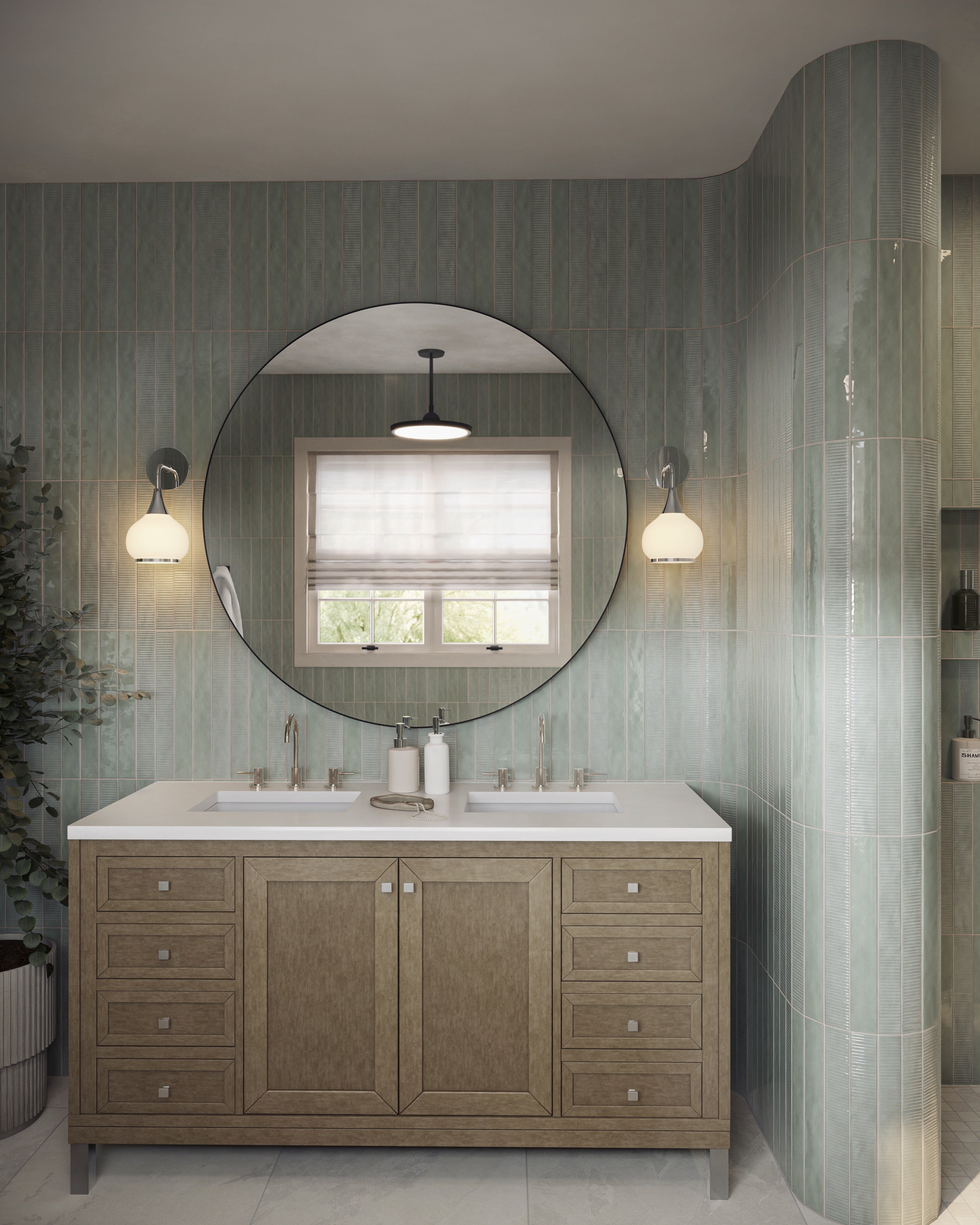 Soft green vertical tiles and a round mirror frame the Janelle 60 inch double vanity in Walnut Whisper, where warm brown cabinetry meets a White Zeus Silestone countertop.