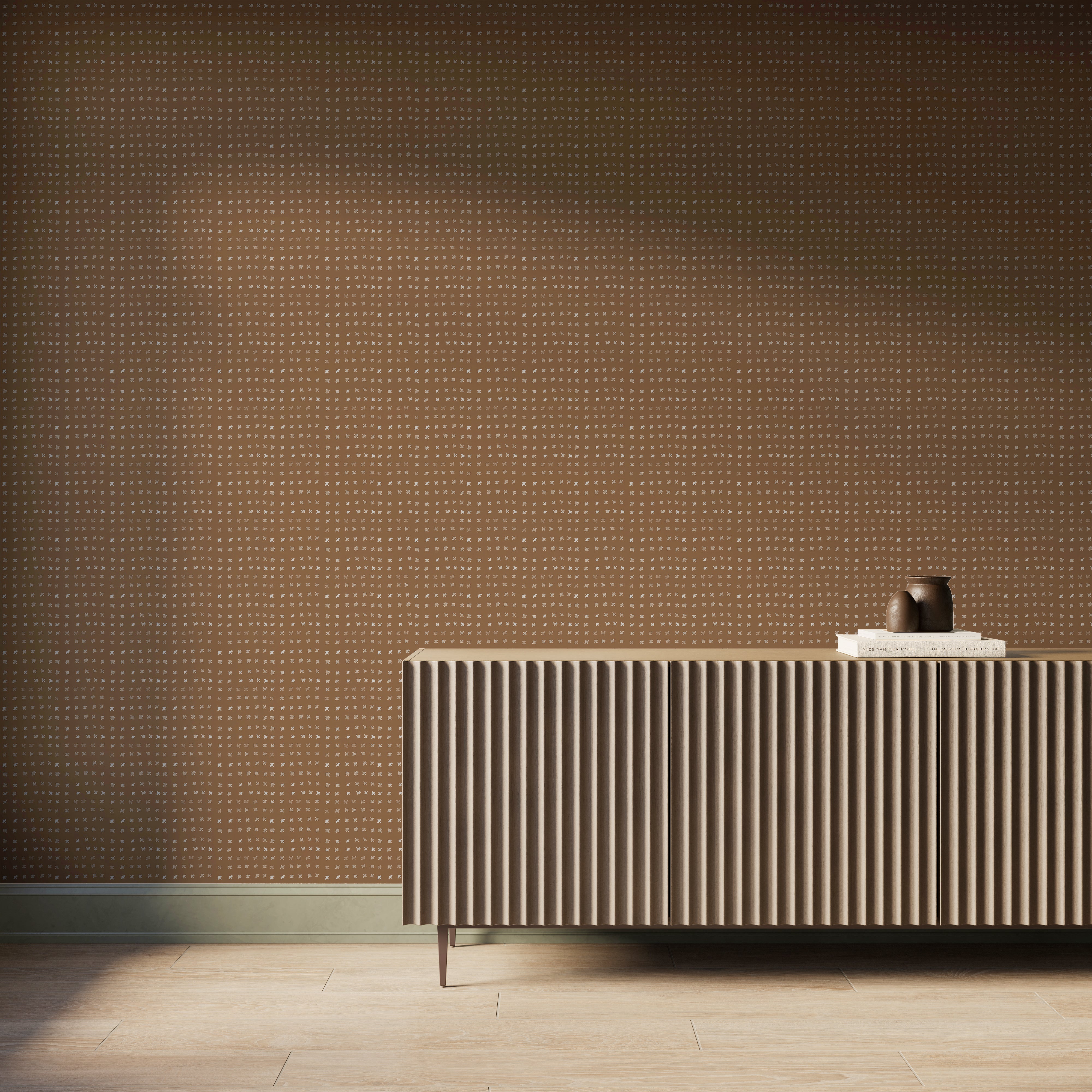 Terracotta II Somerset wallpaper with warm off-white watercolor-style motifs across a brown wall behind a ribbed wood console, fitting warm modern interiors.