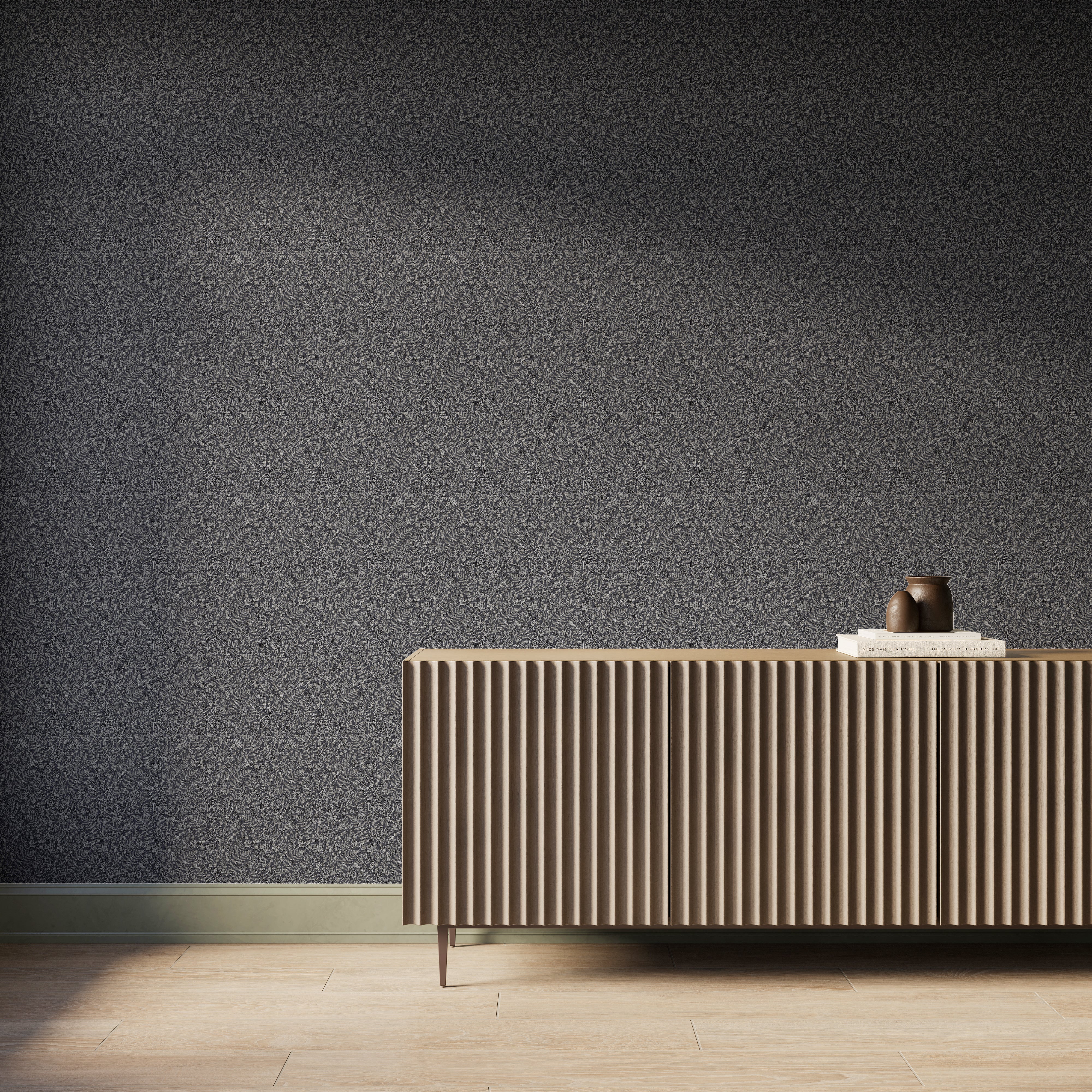 Modern interior featuring deep black botanical wallpaper with delicate creamy white hand-sketched foliage, paired with a fluted wood console cabinet, light wood flooring, and soft natural light casting gentle shadows across the wall.