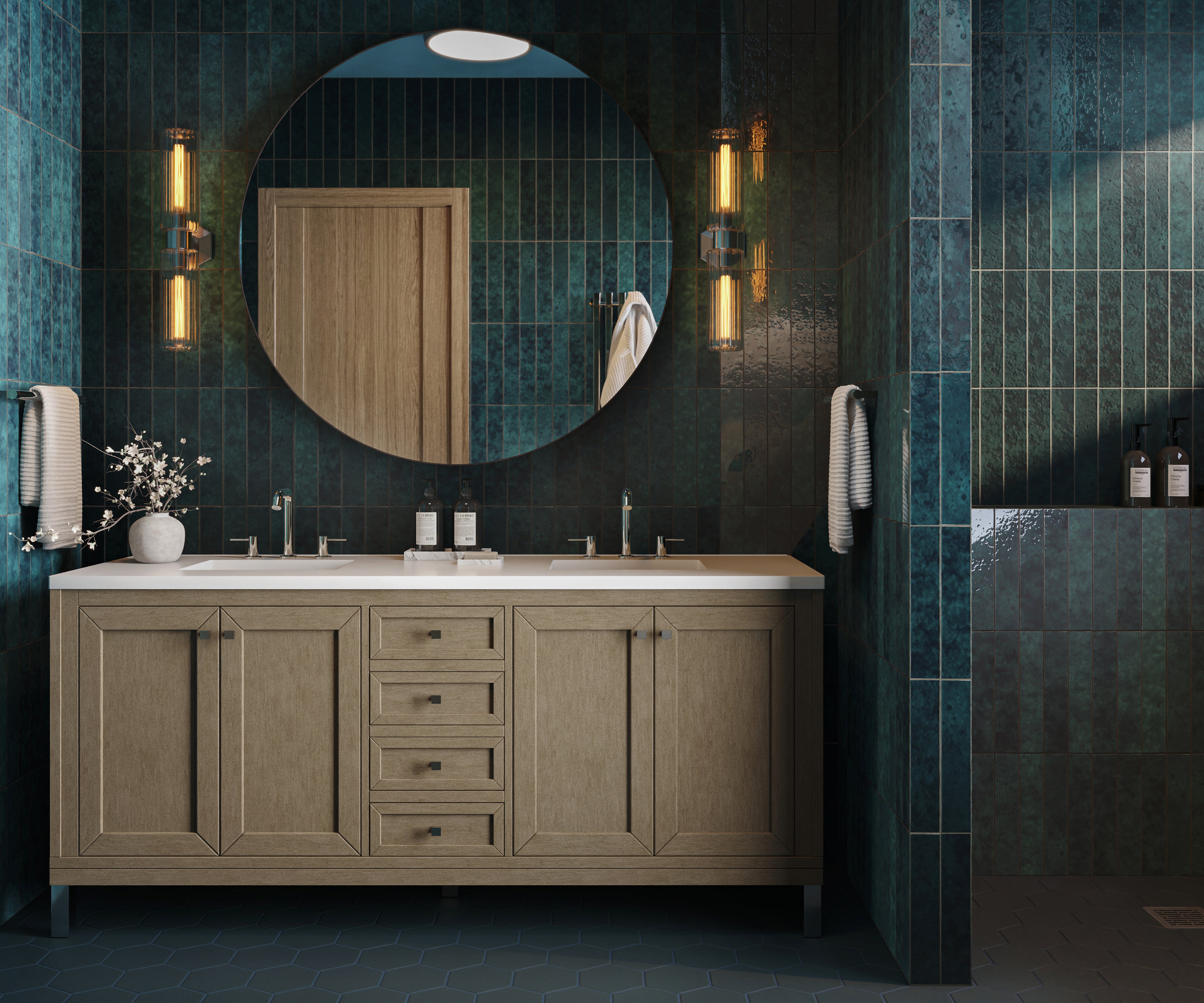 A 72 inch double vanity in Walnut Whisper with warm brown cabinetry and a White Zeus Silestone countertop paired with teal tiled walls, brass lighting, and a large round mirror.