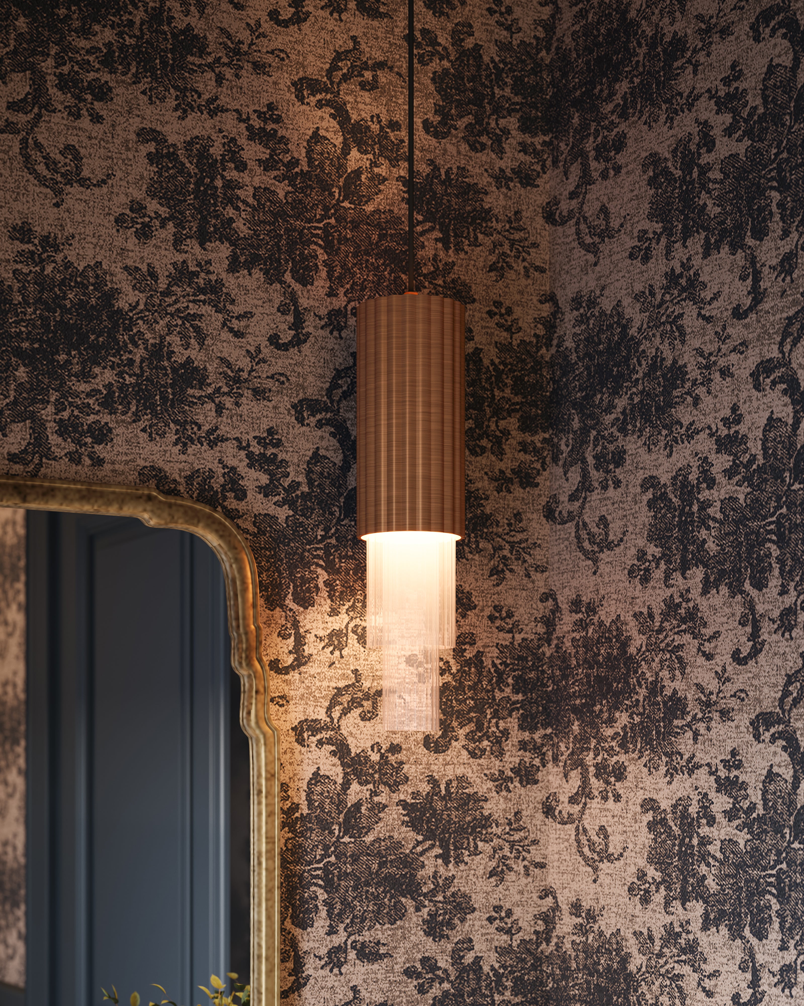 Modern LED pendant light with ribbed copper finish, clear fluted glass, patterned wallpaper, and mirror.