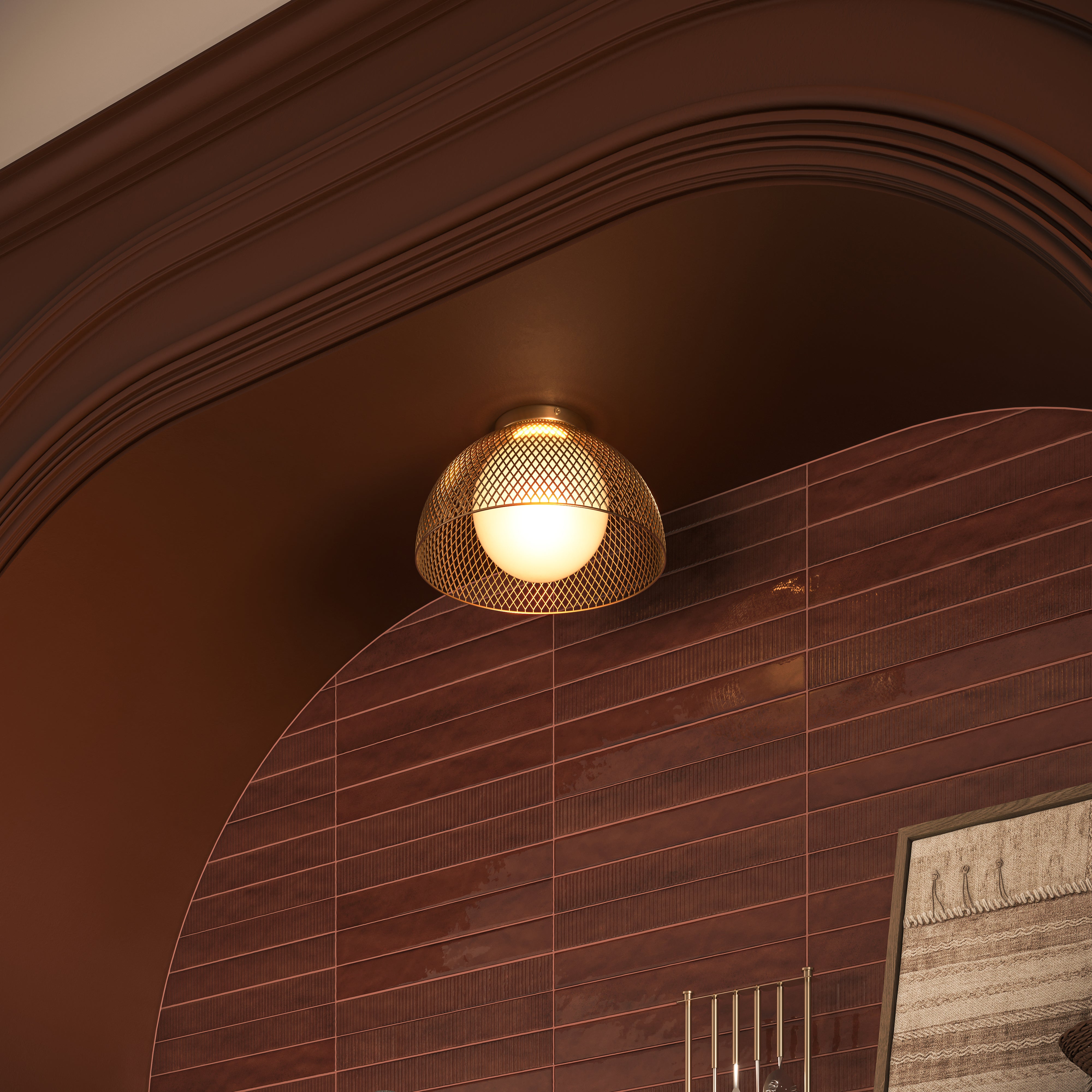 Gold lattice flush mount light with an opal glass globe illuminating a tiled wall.