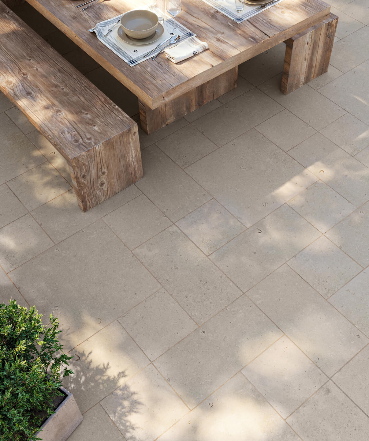 Neutral-toned outdoor floor tile with a natural stone look, creating a refined base for al fresco dining and garden settings.