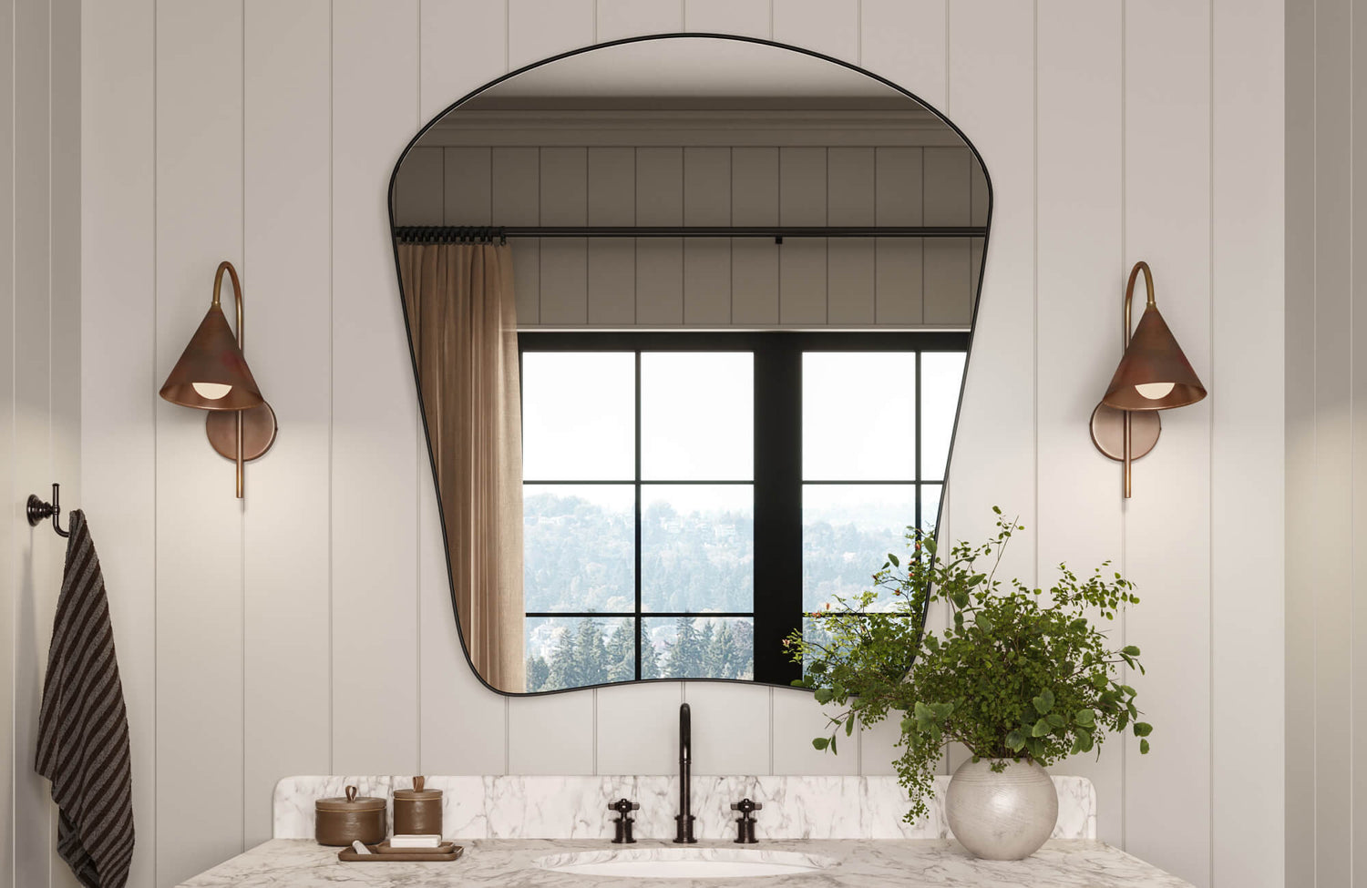 Bathroom vanity with marble countertop, arched mirror, and bronze cone sconces set against vertical white shiplap paneling.