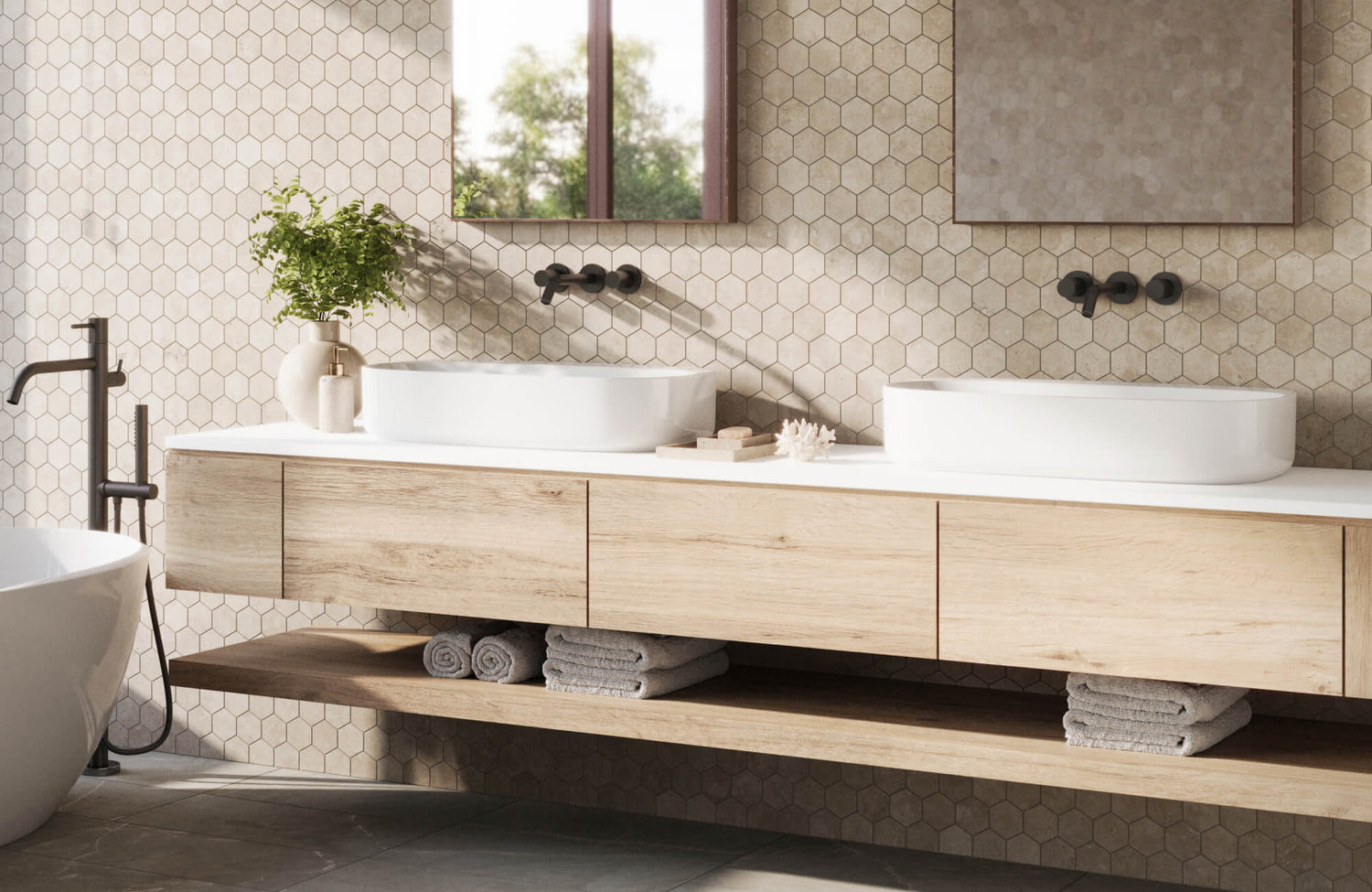 Elegant bathroom featuring soft beige hexagon wall tiles, a floating wood vanity, and twin vessel sinks for a serene, spa-like ambiance.
