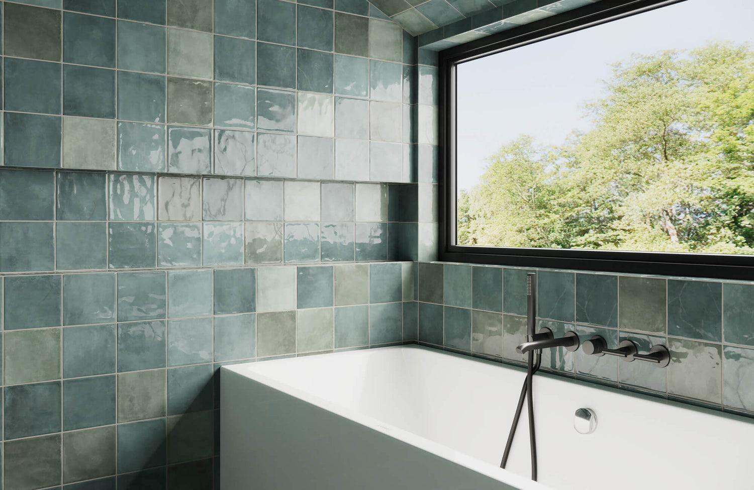 A serene bathroom wall features glazed ceramic tiles in seafoam and teal hues, contrasted by modern black fixtures and an oversized window.