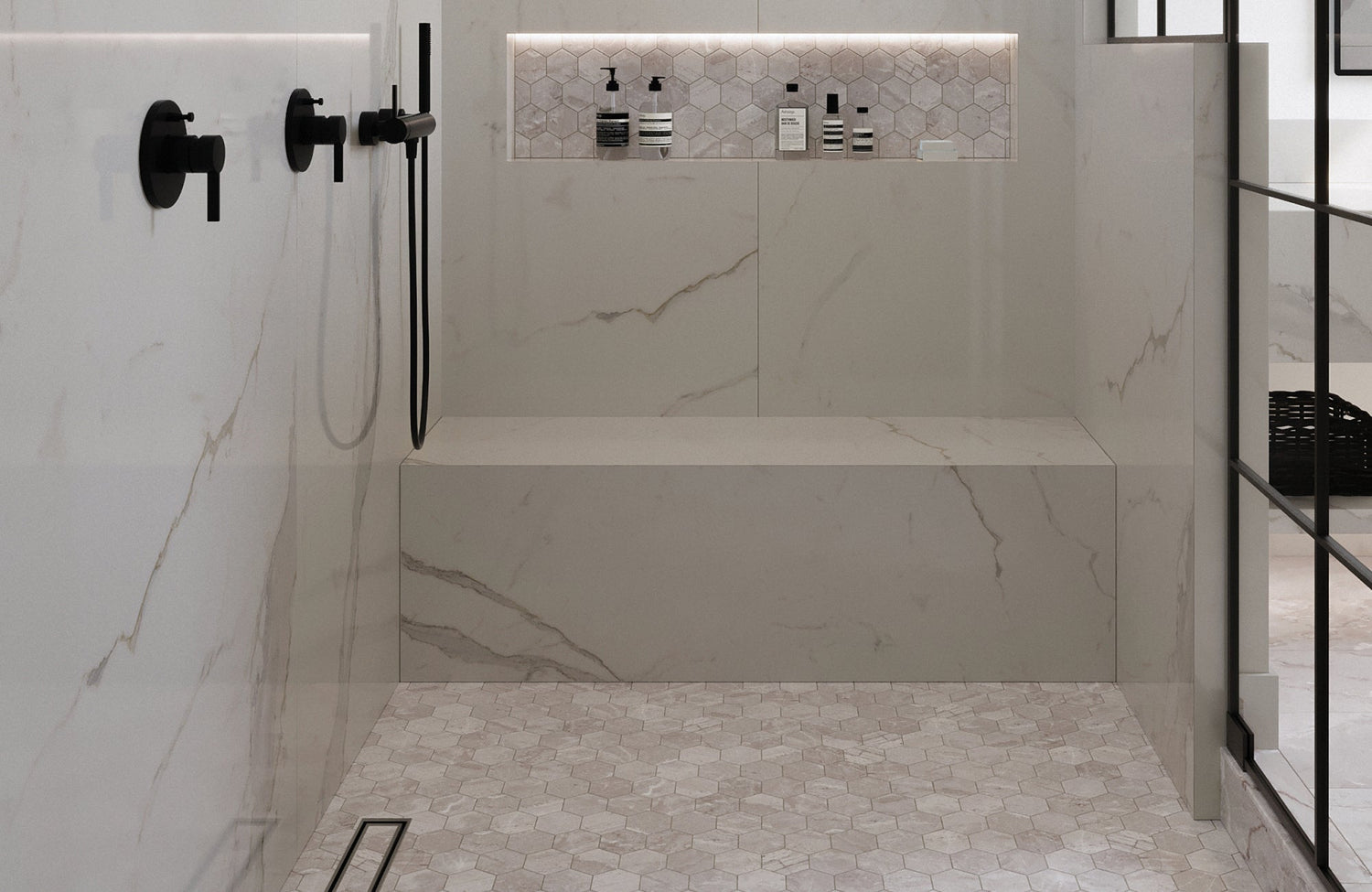 Light beige hexagon shower floor tiles create a soft, neutral base that balances the surrounding marble-look walls.