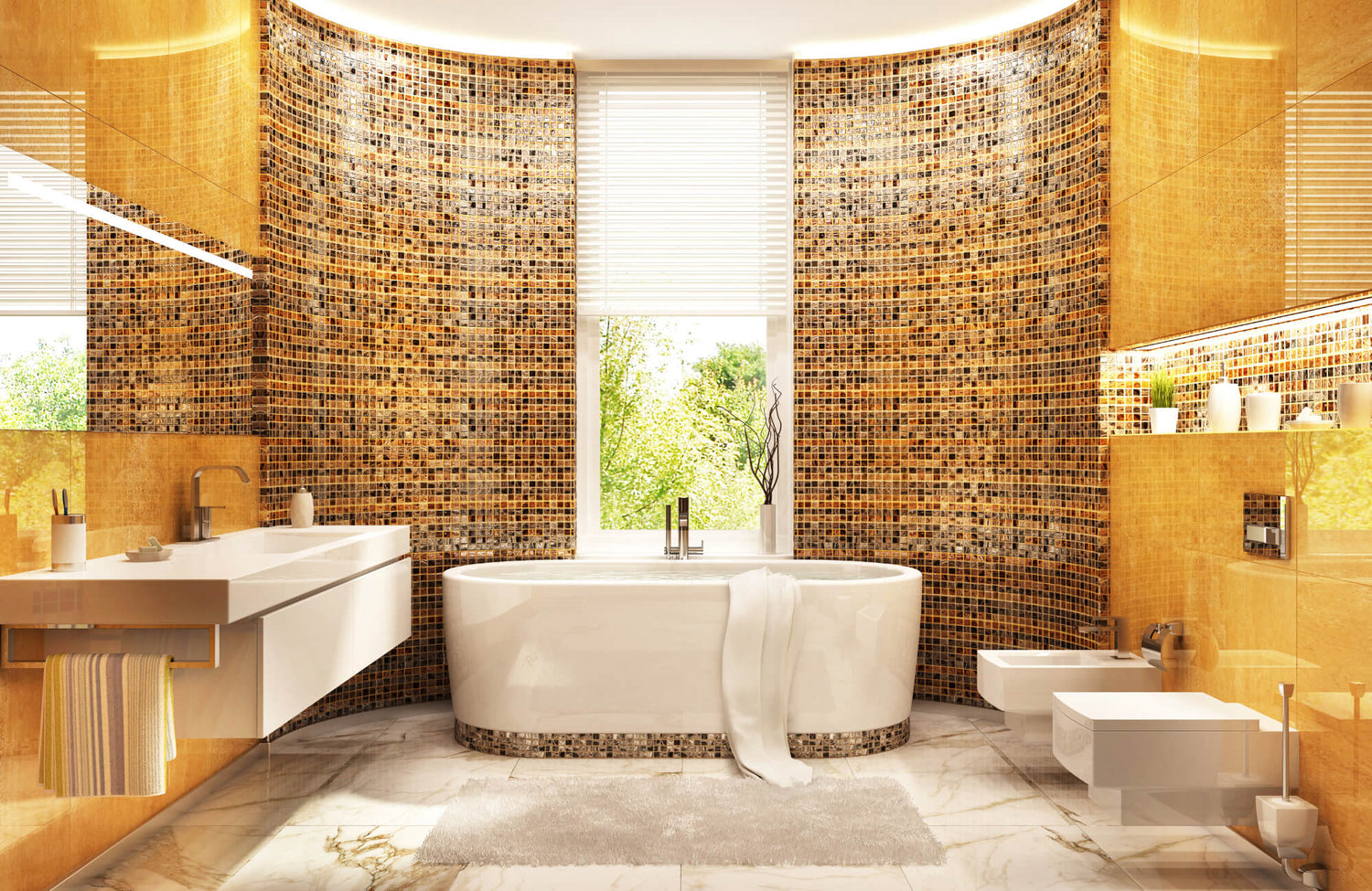 Luxurious bathroom with gold and brown mosaic tile walls, freestanding white bathtub, and modern fixtures in natural light.