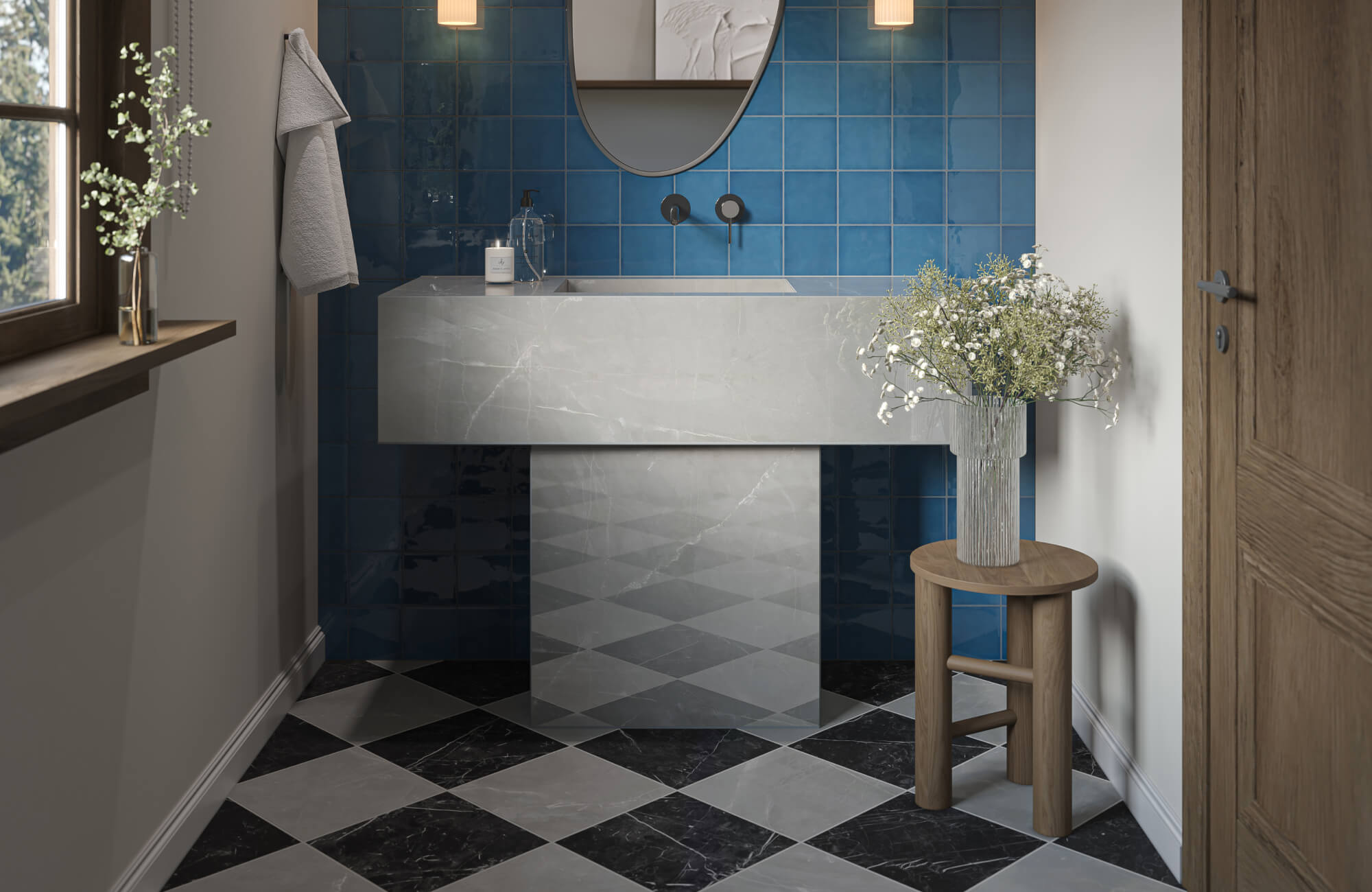 Contemporary bathroom with deep blue wall tiles, a sculptural marble sink, and checkered black-and-gray tile flooring.