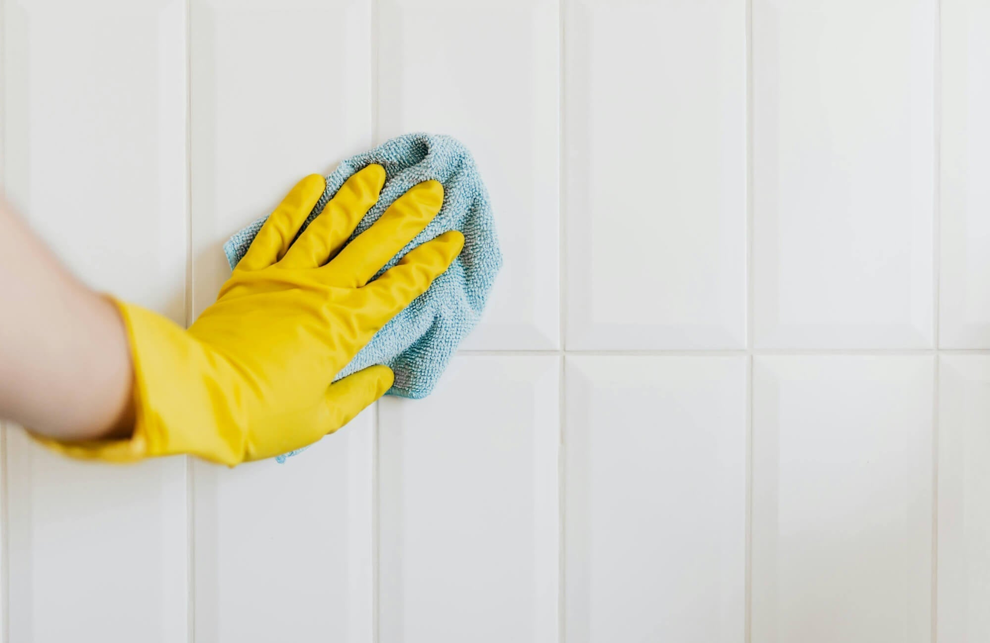 Glossy white subway tiles wipe clean with ease, as the smooth surface resists buildup, making everyday maintenance quick with a soft cloth and mild cleaner.