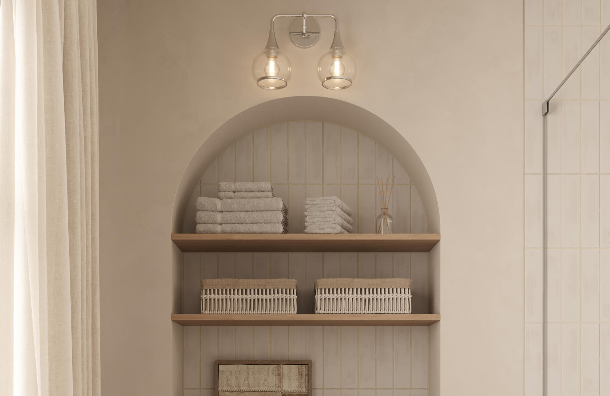 Modern brushed nickel wall lights with double clear glass shades mounted above an arched bathroom shelf, providing warm ambient illumination in a neutral-toned space.