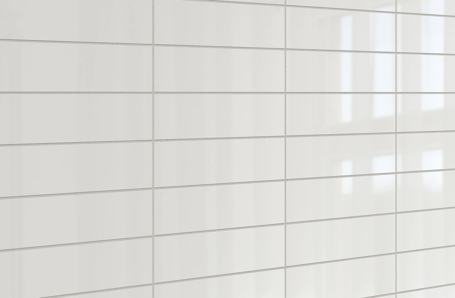 Glossy white rectangular tiles arranged in a clean grid pattern, reflecting natural light for a sleek, modern finish.