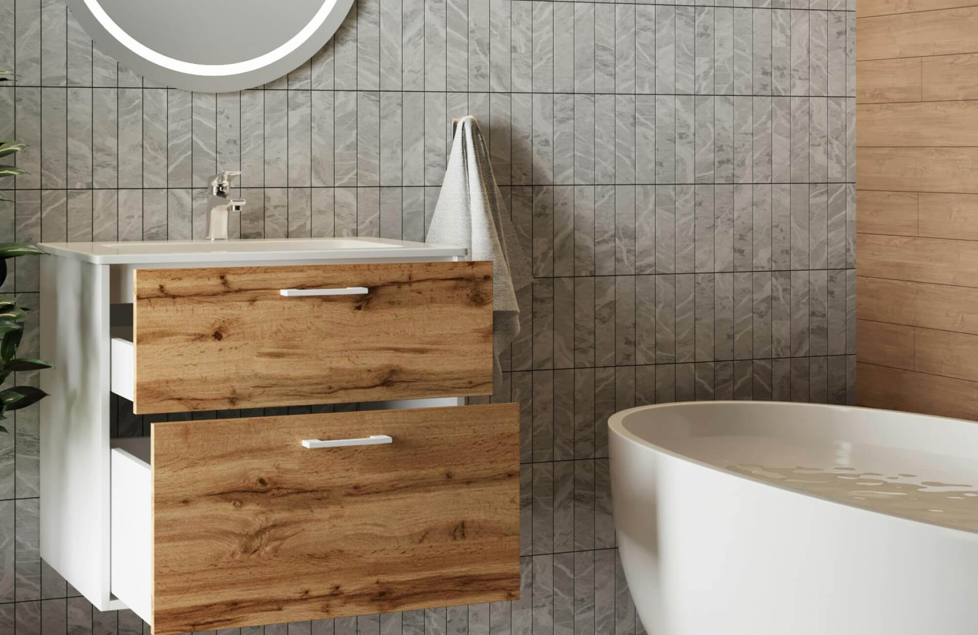 A modern bathroom features a warm wood bathroom vanity with natural grain drawers, paired with a sleek white sink, textured gray vertical tile backsplash, and a smooth freestanding tub that enhances the space’s clean, contemporary feel.