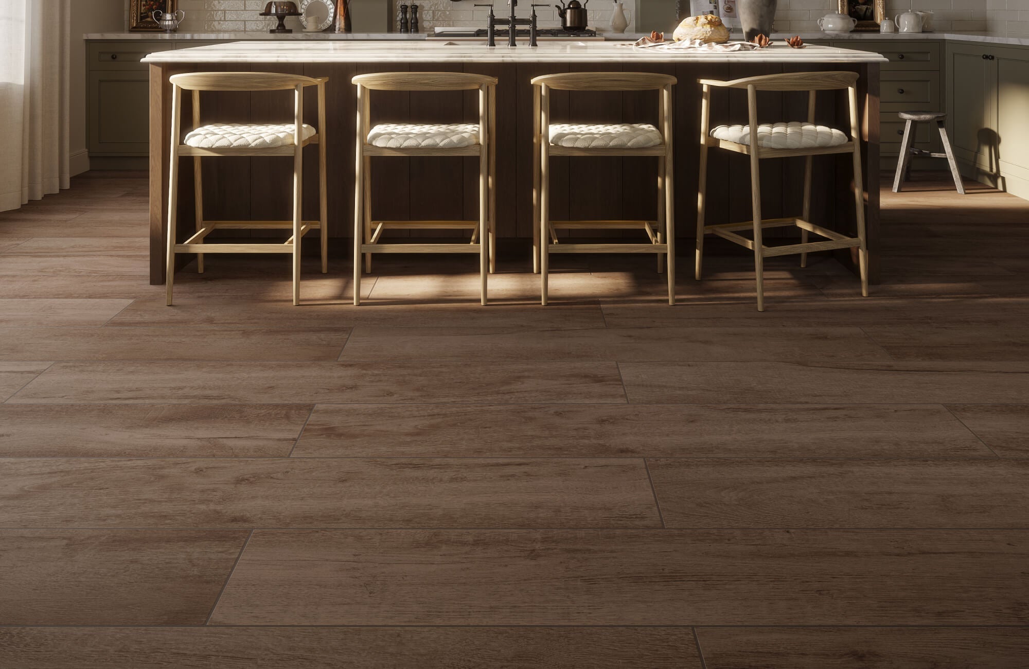 Warm kitchen with wide plank wood look tile flooring, light wood counter stools, and a sunlit island for a cozy, rustic feel.