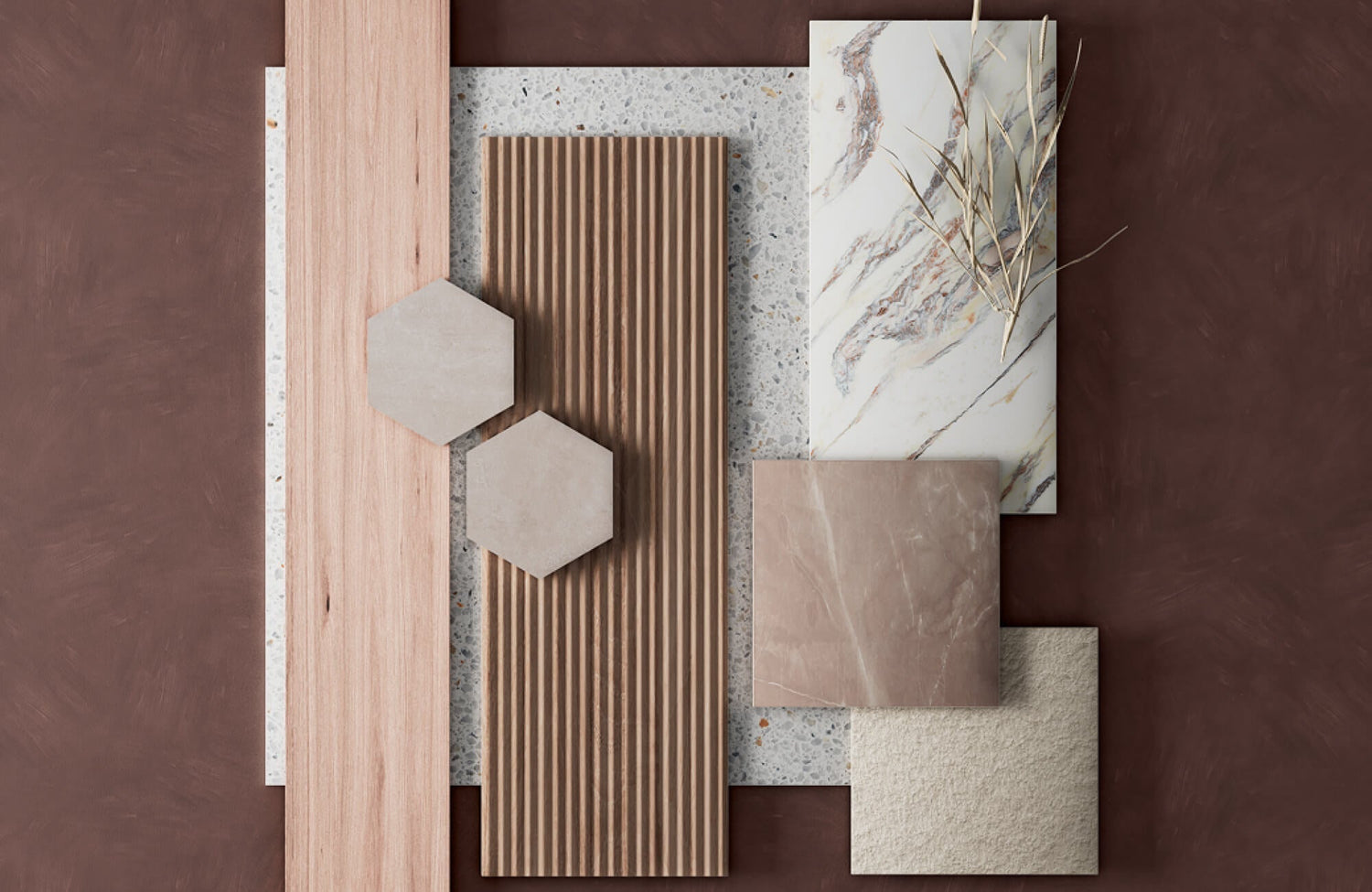 Flat lay of mixed materials featuring the looks of wood slats, terrazzo, marble, textured stone, and neutral hexagon tiles.
