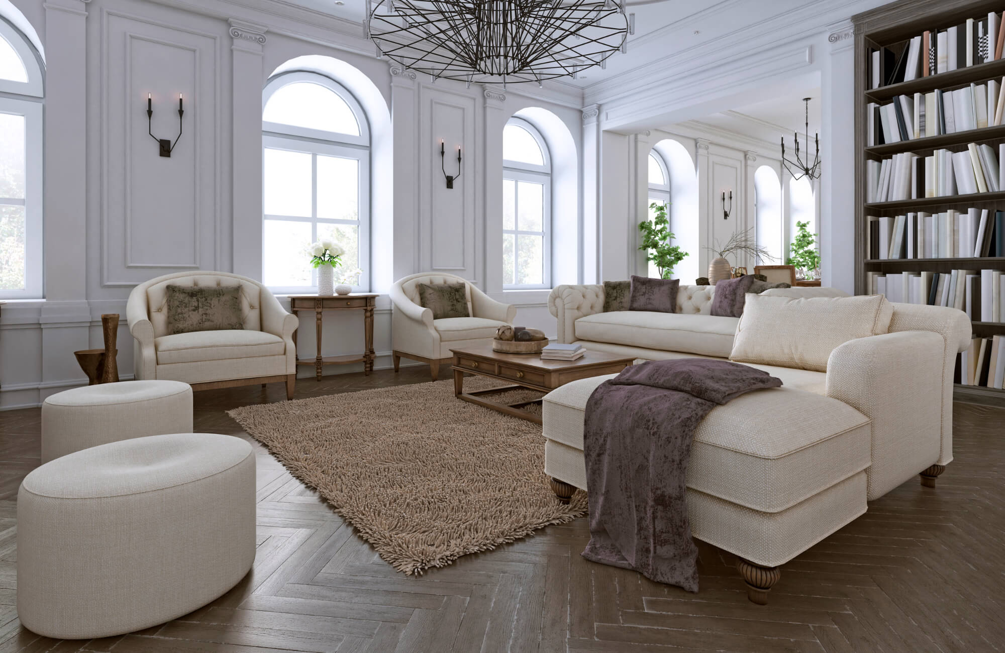 Elegant living room with neutral furniture and dark herringbone wood flooring beneath tall arched windows and classic wall detailing.
