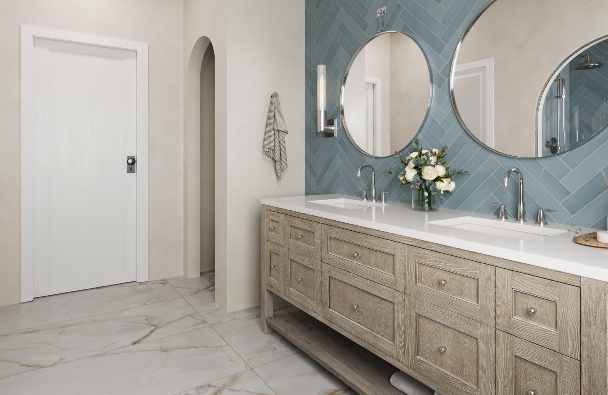 Modern bathroom with two round mirrors above a dual vanity, creating symmetry and enhancing light reflection.