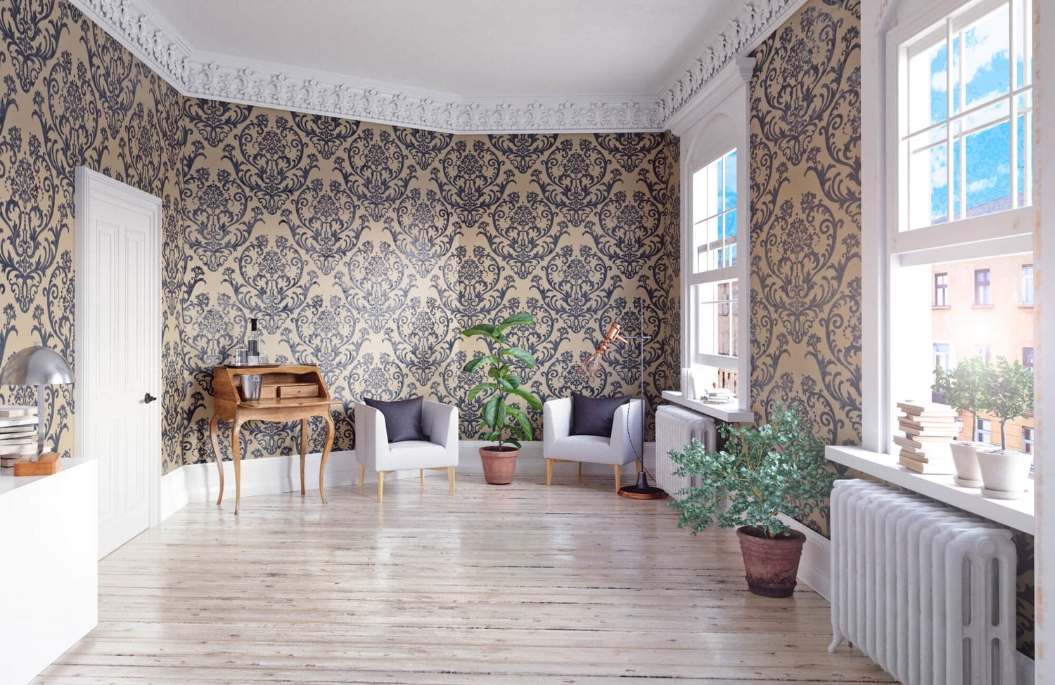Bright room with ornate blue and gold damask wallpaper, white trim, wood floors, and minimal furniture near large windows.
