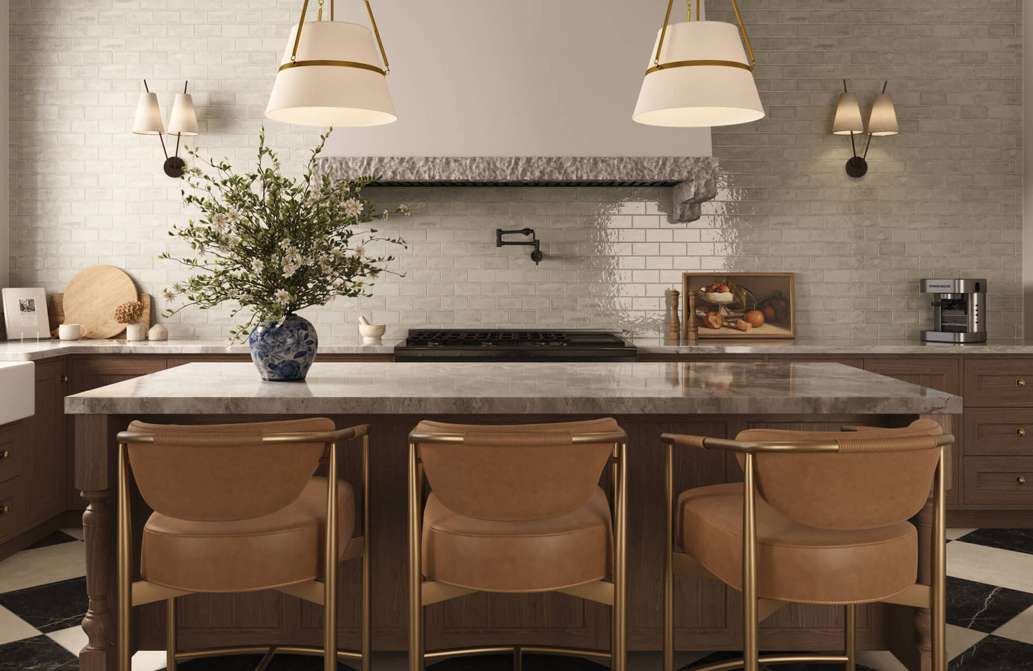 Elegant kitchen with leather and brass barstools, a marble island, ceramic tile backsplash, and warm pendant lighting.