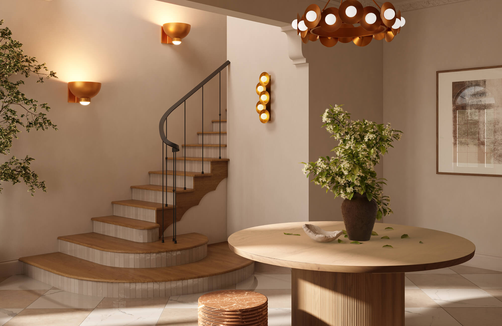 Warm entryway with a curved staircase, layered wall sconces, a circular fluted-base table, and modern sculptural lighting overhead.