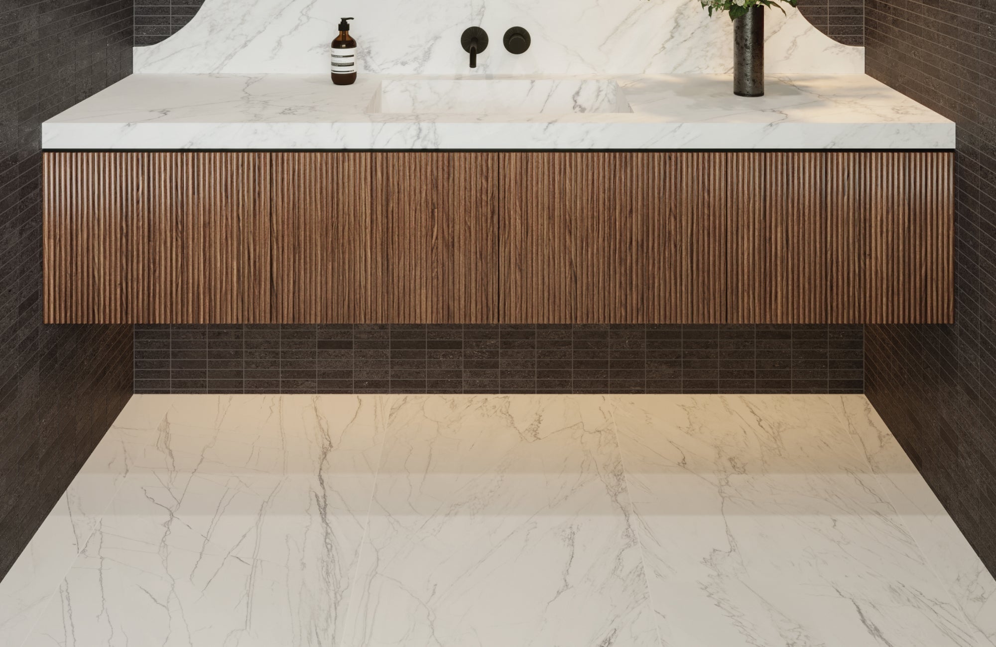 Modern bathroom with ribbed wood floating vanity and marble countertop against dark tile wall and floor