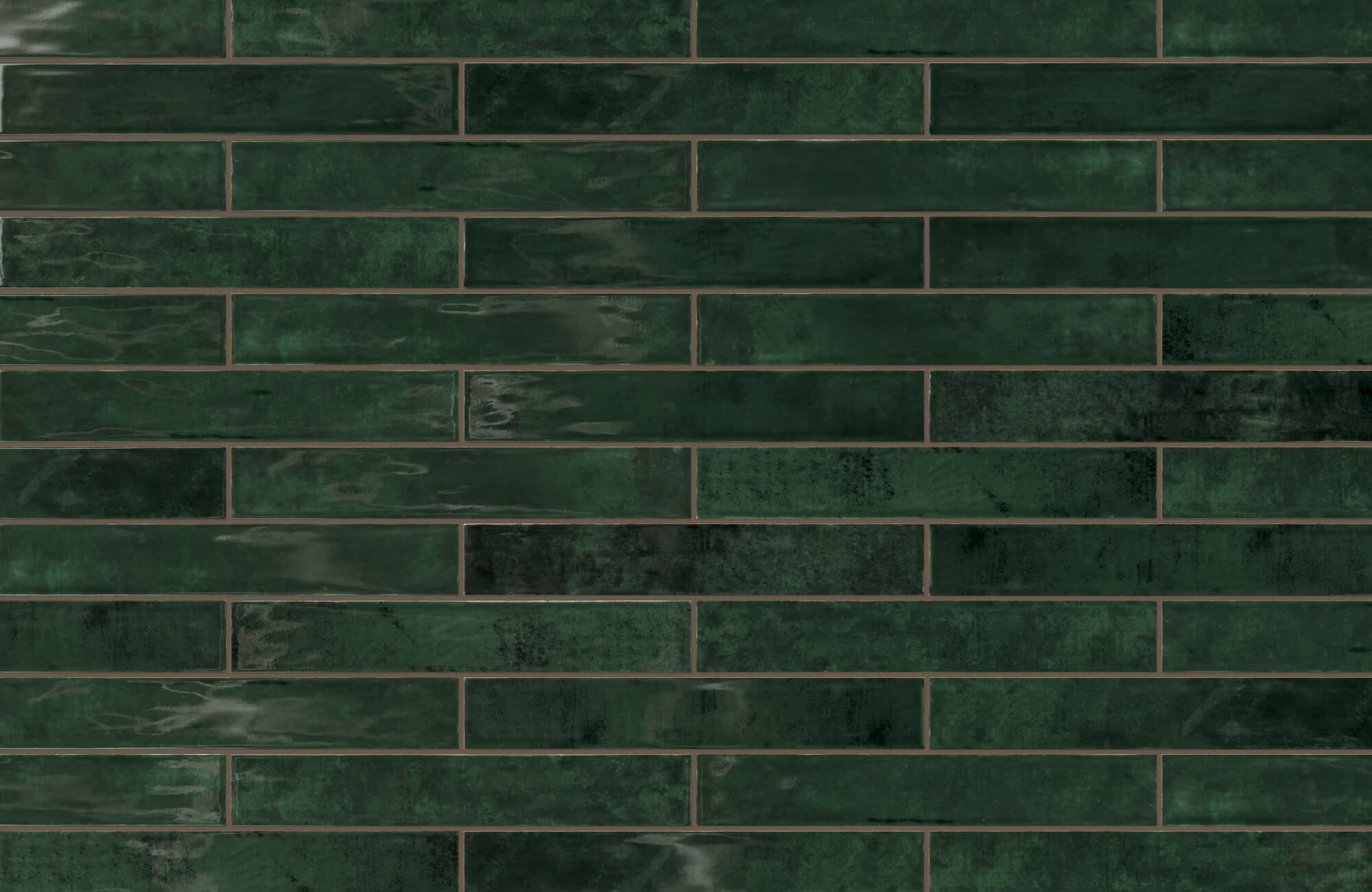 Jaden 2.5x16 glossy ceramic tile in Hunter green boasts a rich, vibrant finish, ideal for adding depth and sophistication to any space.