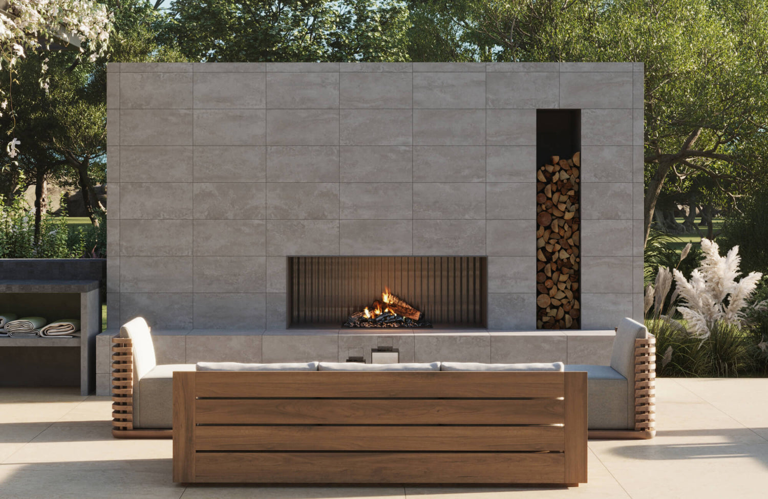 Contemporary outdoor fireplace wall clad in large format porcelain tiles with built-in wood storage and modern seating.