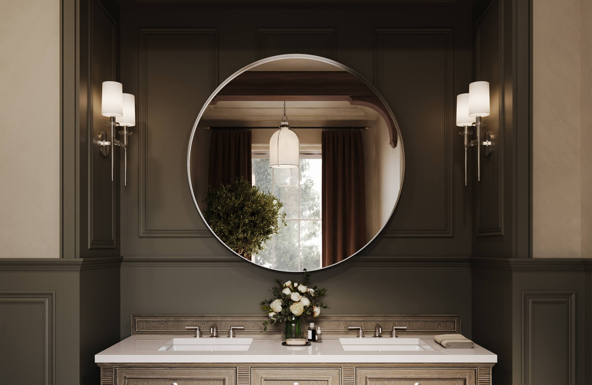 A large round bathroom mirror reflects a warm, elegant interior with paneled dark walls, double sinks, and wall sconces softly illuminating the vanity area.