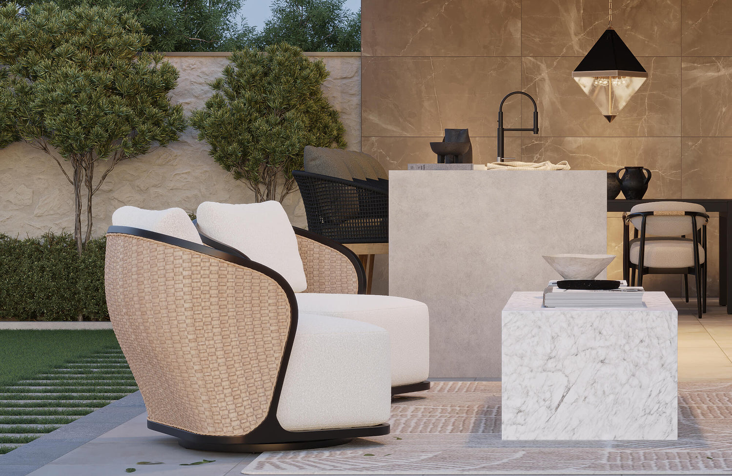 Outdoor dining chair with woven curved frame and plush ivory cushions beside a modern outdoor kitchen and marble accent table.