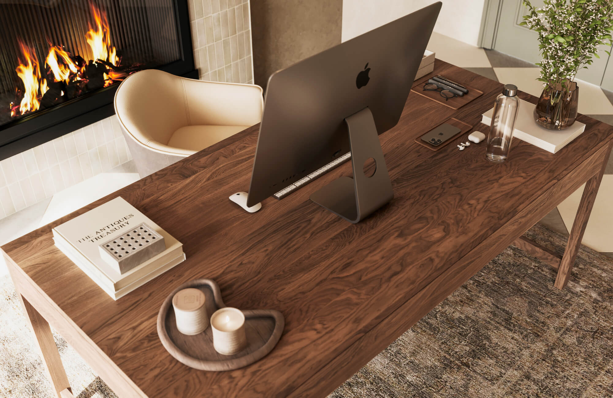 Walnut wood desk with rich grain pattern styled neatly with computer and decor in a warm, modern workspace
