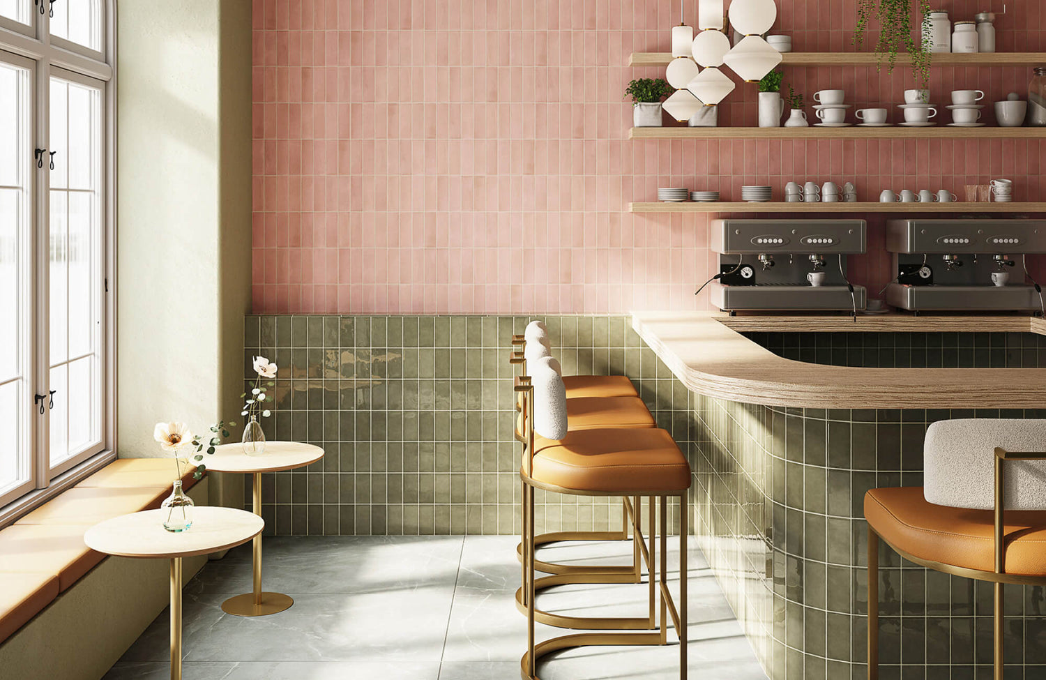 Soft pink vertical wall tiles paired with olive green square tiles, creating a two-tone café interior pattern.