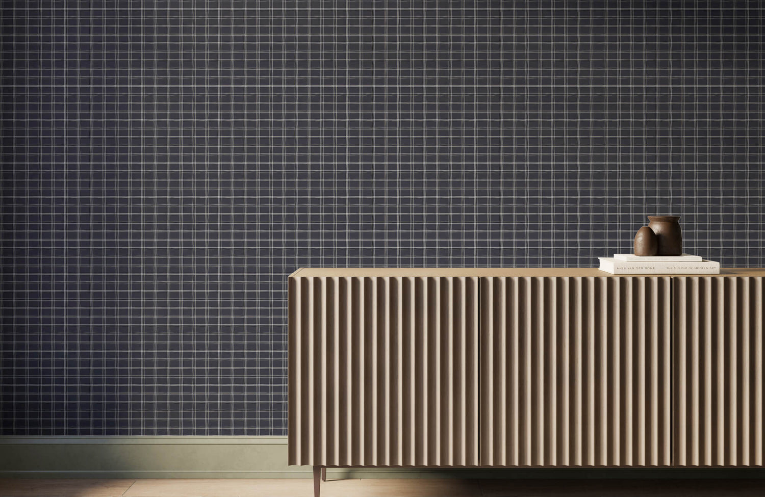 Modern interior with plaid black wallpaper backdrop, featuring a fluted wood sideboard styled with books and a sculptural vase for a refined, minimalist look.