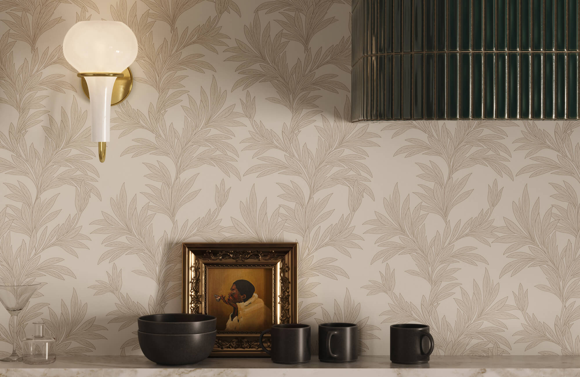 Beige botanical wallpaper with soft taupe leaf detailing on a textured wall, styled with matte black ceramics, a vintage gold frame, and brass wall lighting.