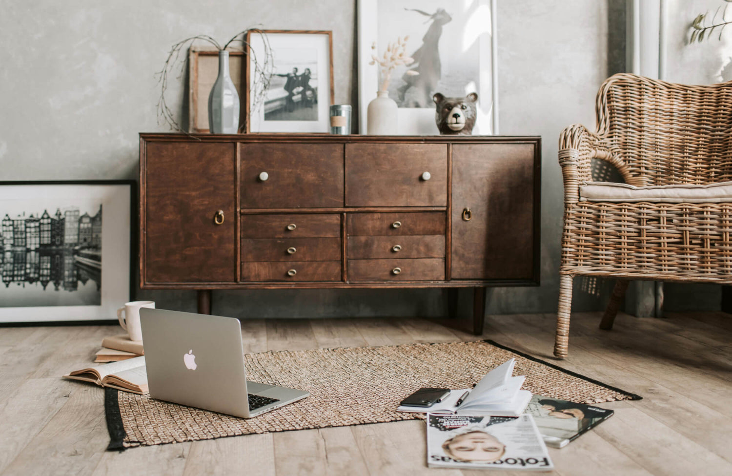 Neutral 5x7 woven rug placed in a cozy living room with wood furniture and a rattan chair.