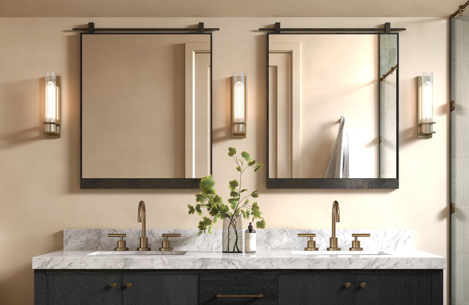 Double bathroom vanity with two rectangular mirrors and warm brass fixtures.