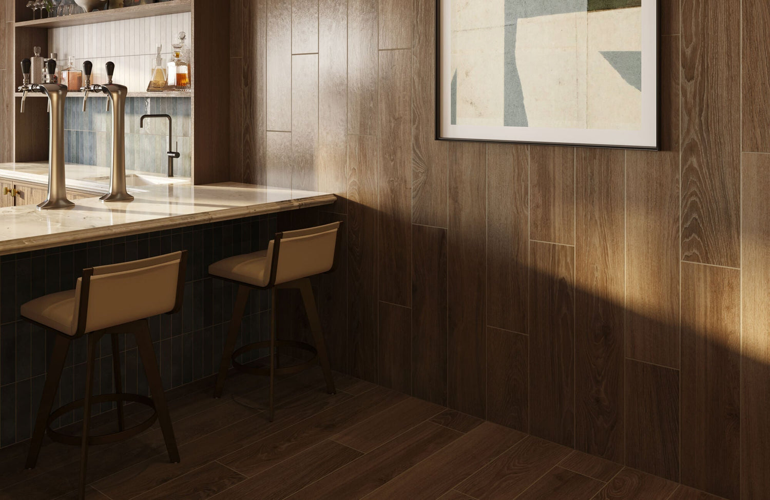 A warm home bar with wood-look tile walls and flooring, a marble counter, blue tile accents, and modern bar stools set beneath soft natural light.