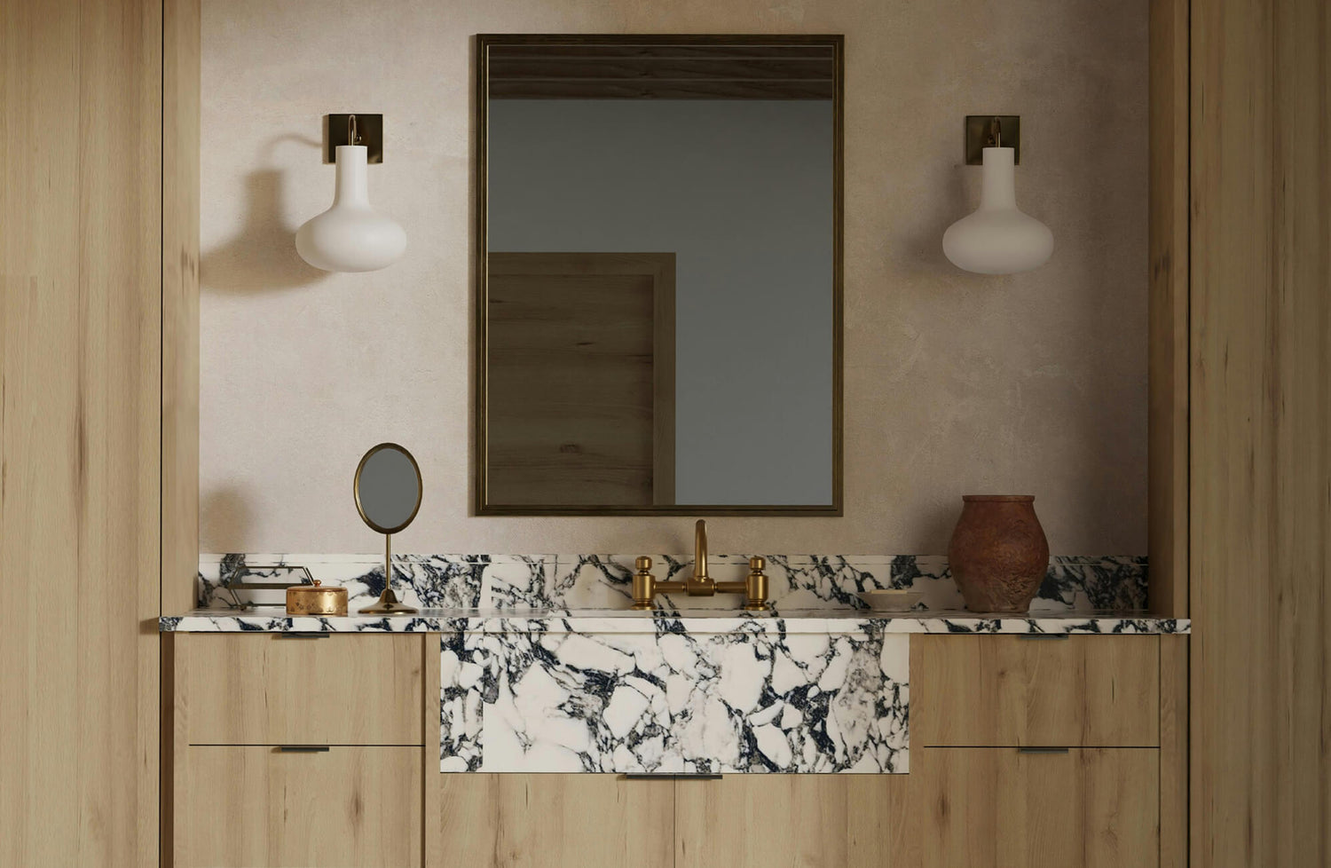Modern vanity with a large rectangular mirror, marble countertop, and brass fixtures that exude timeless elegance.