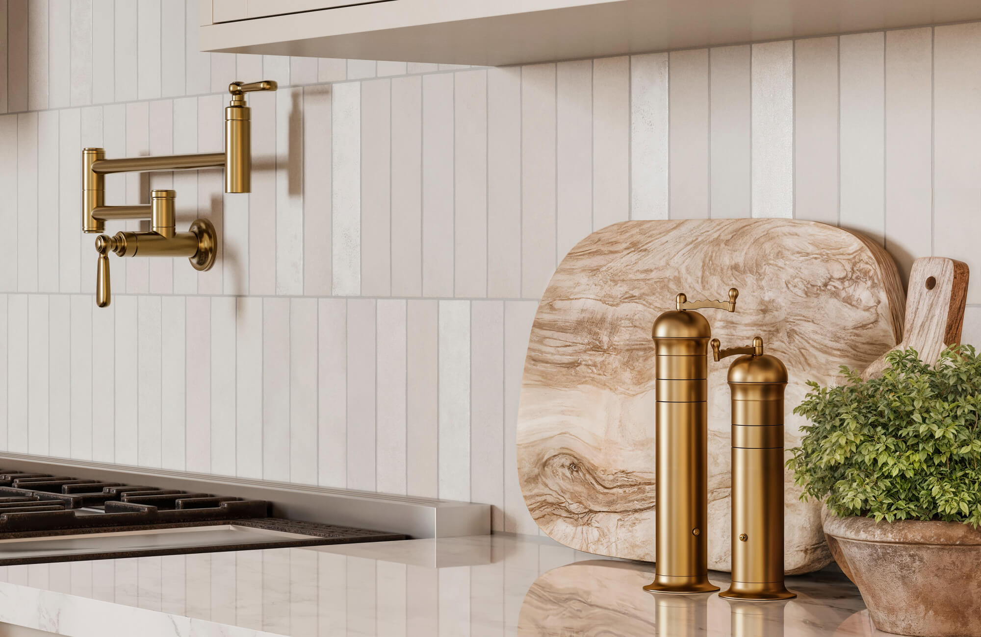 Slim vertical ceramic tiles in soft cream tones create a sleek backsplash behind a brass pot filler and modern kitchen decor.